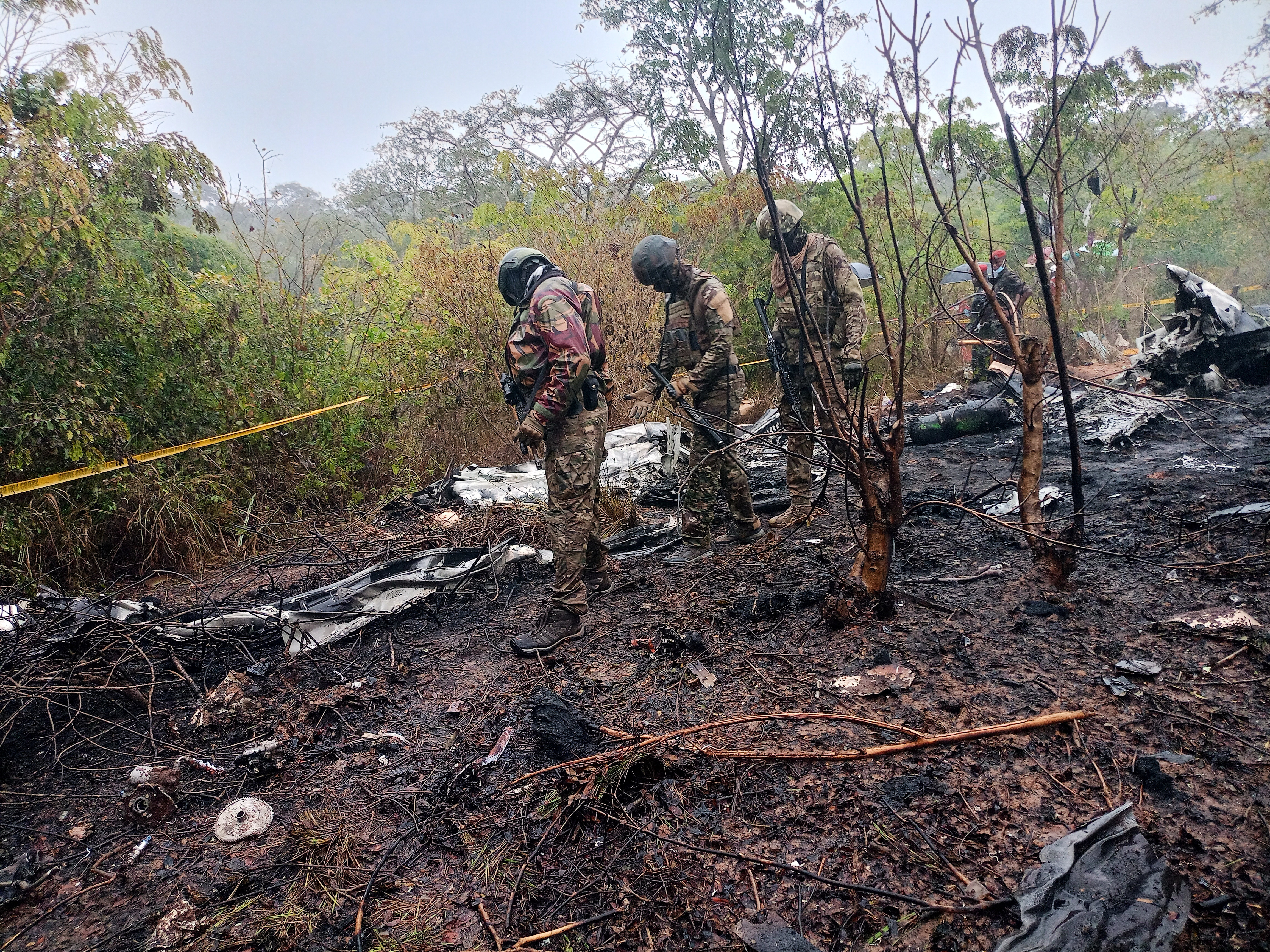 Kenyan officials inspect the scene of a plane crash near Diani, Kenya, Tuesday, Oct. 28, 2025. (AP Photo)