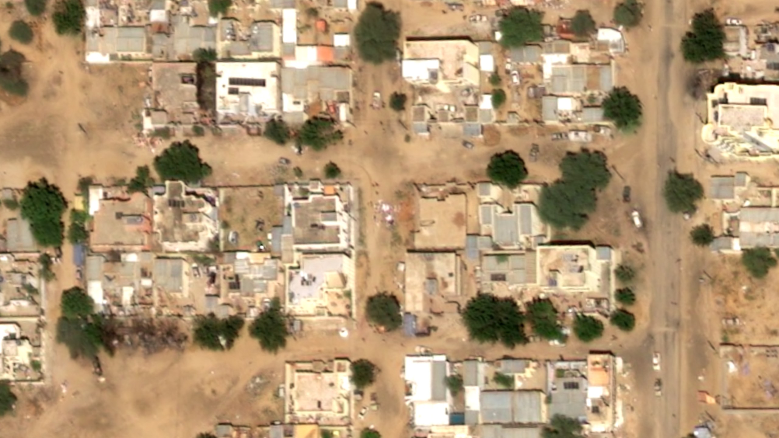This satellite image taken by Airbus DS shows objects on the ground near what are likely Rapid Support Forces vehicles in the Daraja Oula neighborhood of el-Fasher, Sudan, Monday, Oct. 27, 2025. (Airbus DS 2025 via AP)