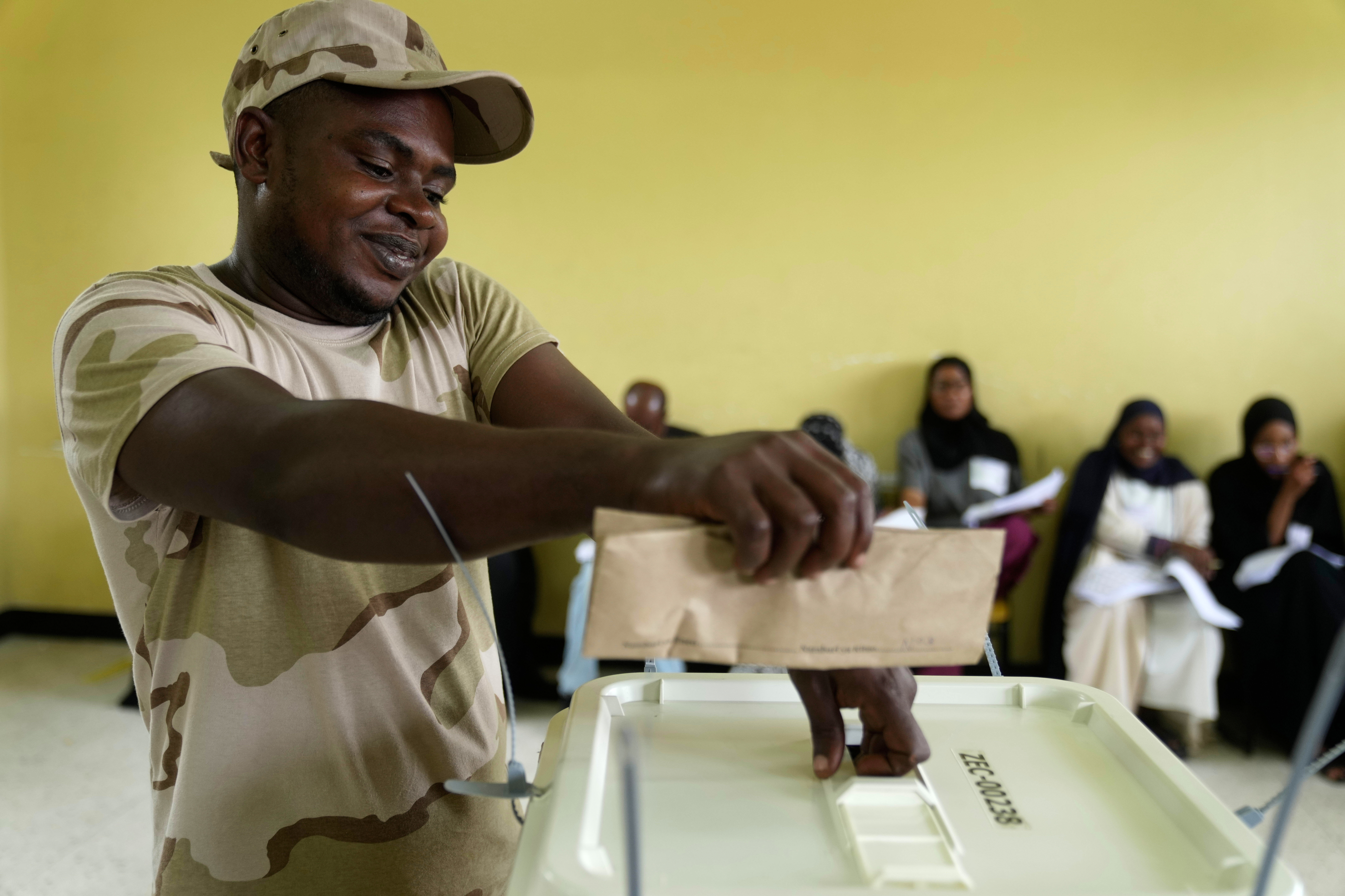 A security personnel member casts his vote during early voting in the general elections at Tumekuja Secondary School polling station in Zanzibar, Tanzania, Tuesday, Oct. 28, 2025. (AP Photo/Brian Inganga)