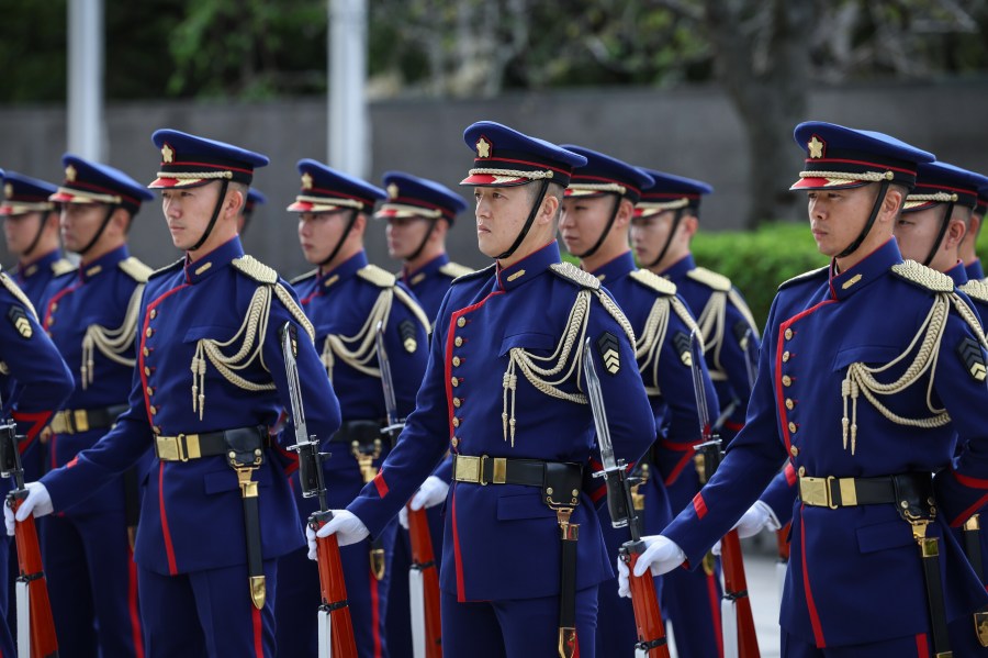 A guard of honor stands for inspection by U.S. Defense Secretary Pete Hegseth and Japan's Defense Minister Shinjiro Koizumi, both unseen, in Tokyo Wednesday, Oct. 29, 2025. (Takashi Aoyama/Pool Photo via AP)