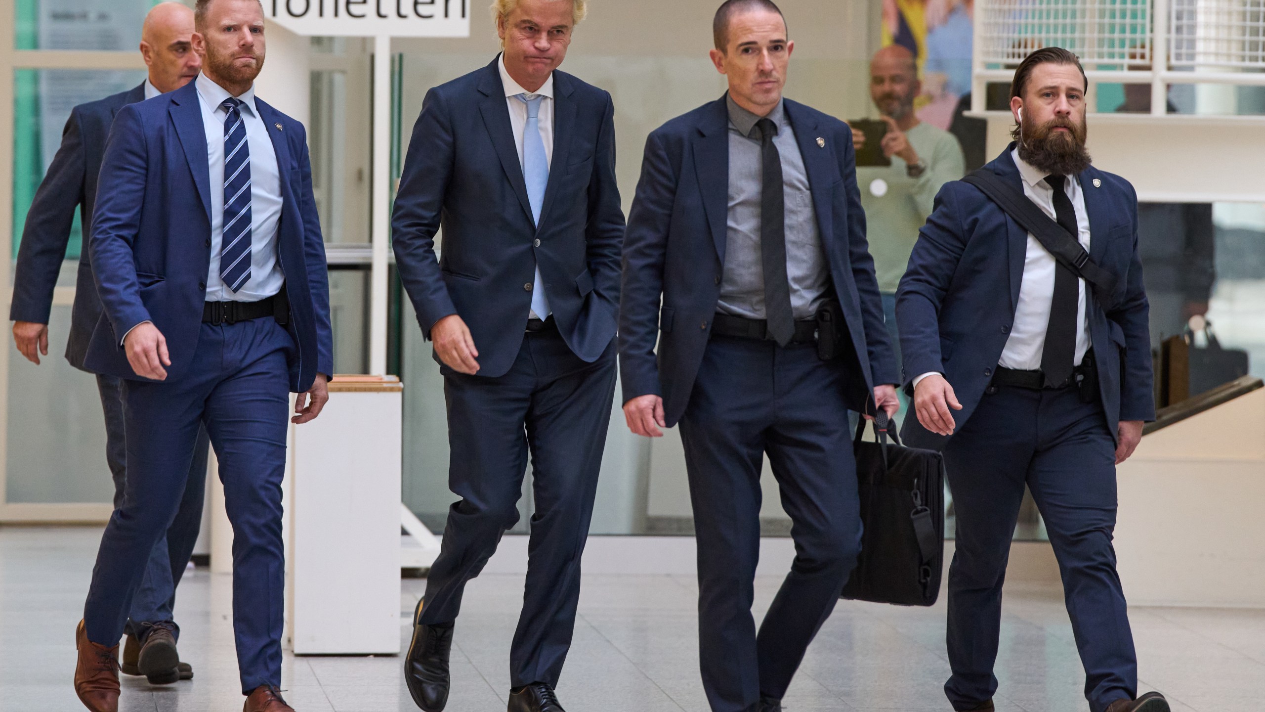 Far-right anti Islam lawmaker Geert Wilders, center, arrives at a polling station during general elections in The Hague, Netherlands, Wednesday, Oct. 29, 2025. (AP Photo/Peter Dejong)