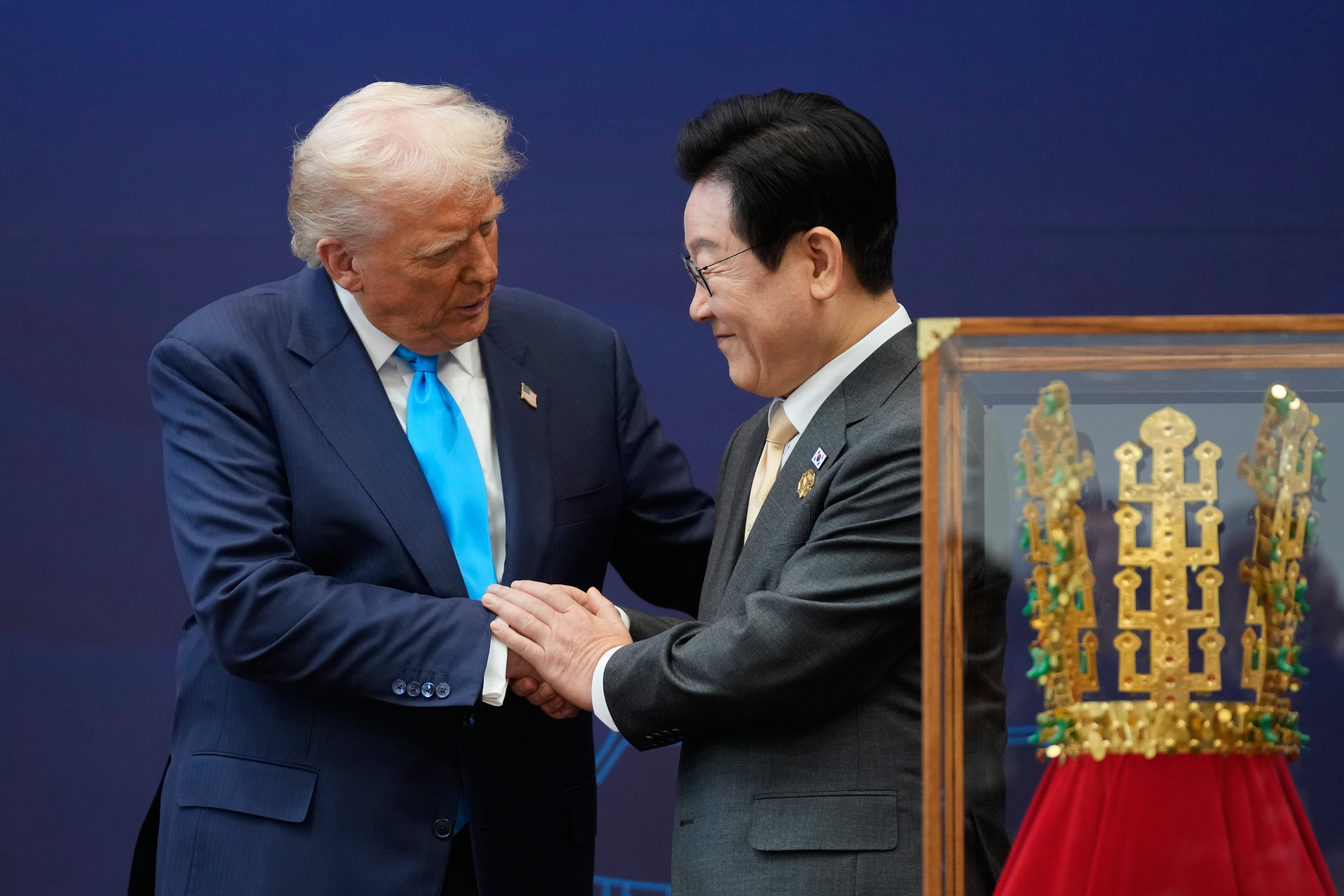 President Donald Trump shakes hands with South Korean President Lee Jae Myung as they attend a high honor ceremony at the Gyeongju National Museum in Gyoeongju, South Korea, Wednesday, Oct. 29, 2025. (AP Photo/Mark Schiefelbein)