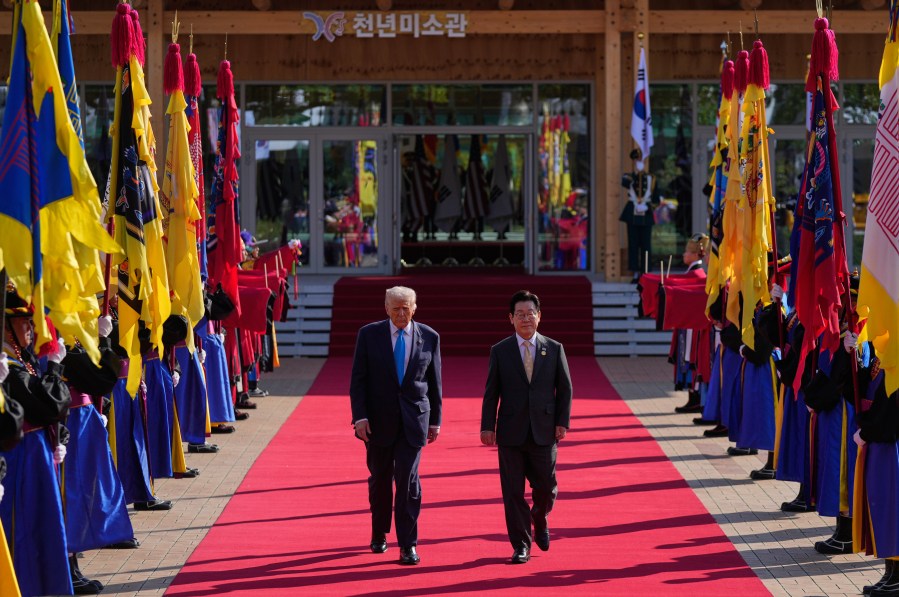 President Donald Trump and South Korean President Lee Jae Myung walk in a welcome ceremony at the Gyeongju National Museum in Gyeongju, South Korea, Wednesday, Oct. 29, 2025. (AP Photo/Mark Schiefelbein)