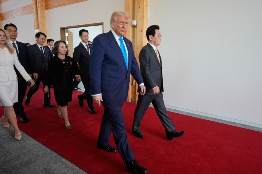 President Donald Trump, center, and South Korean President Lee Jae Myung, right, attend a high honor ceremony at the Gyeongju National Museum in Gyoeongju, South Korea, Wednesday, Oct. 29, 2025. (AP Photo/Mark Schiefelbein)