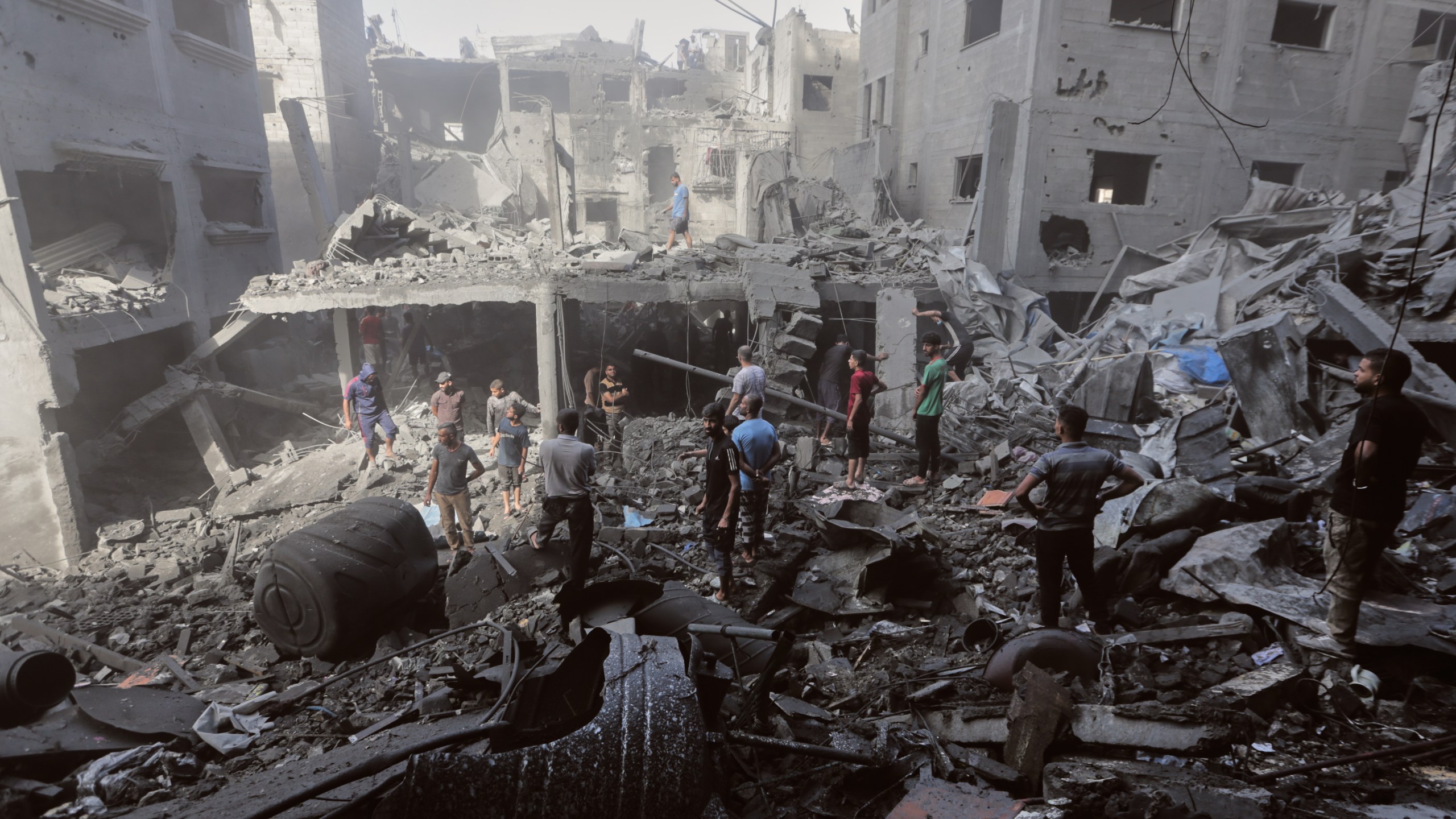 Palestinians inspect the rubble of a building, destroyed by an Israeli army strike at Al-Shati camp in Gaza City Wednesday, Oct. 29, 2025. (AP Photo/Yousef Al Zanoun)
