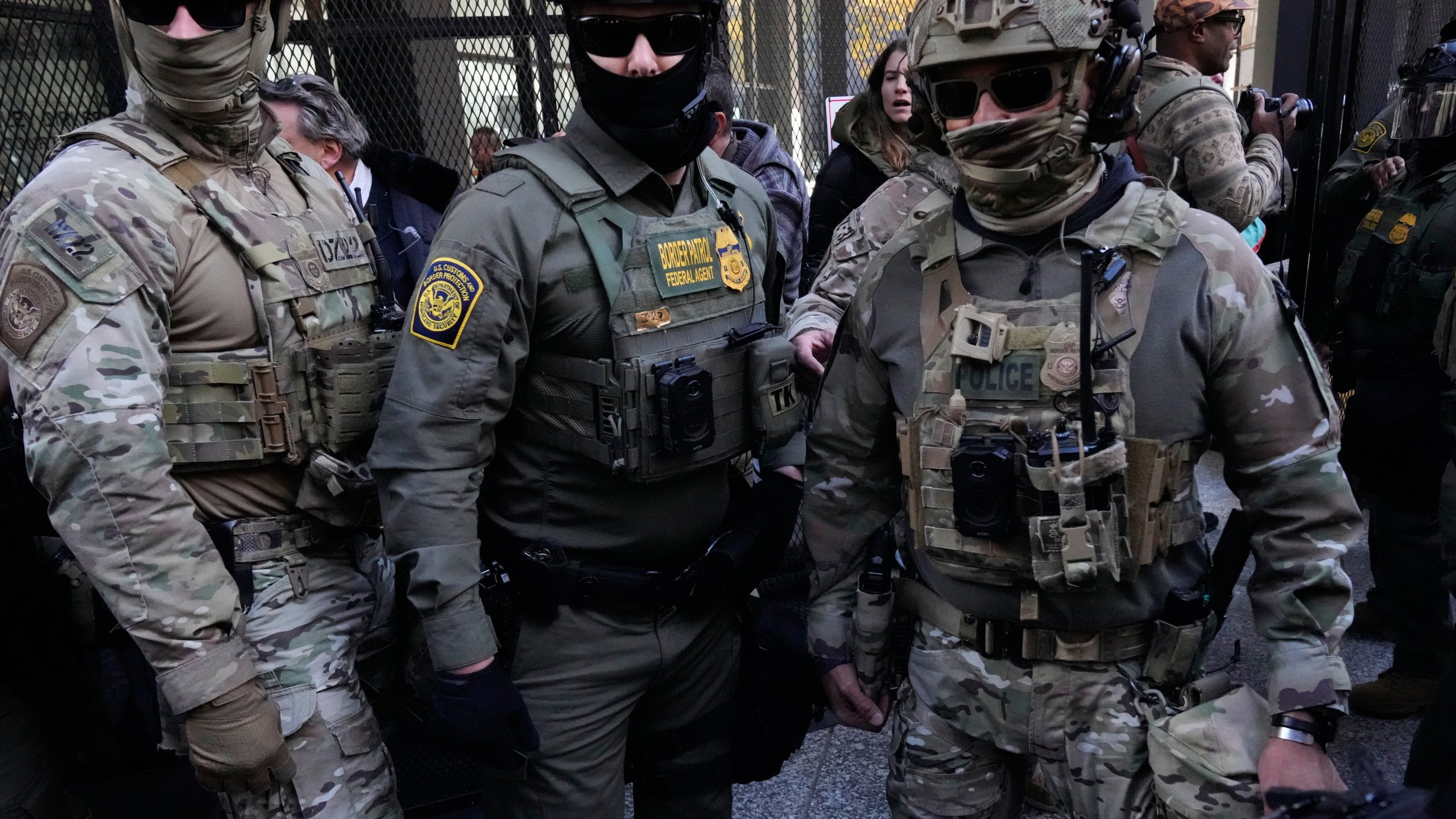 U.S. Customs and Border Patrol agents arrive to escort U.S. Customs and Border Patrol Gregory Bovino from federal court in Chicago, Tuesday, Oct. 28, 2025. (AP Photo/Nam Y. Huh)