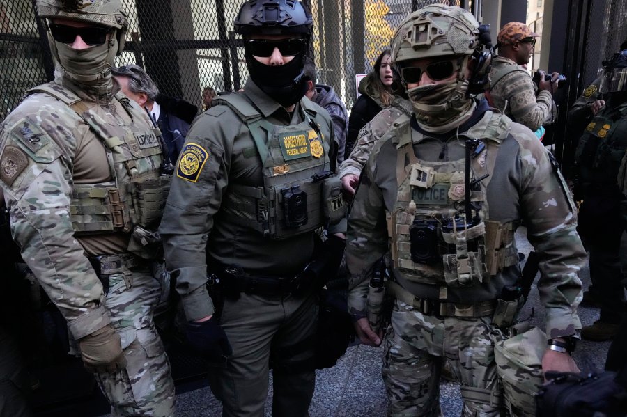 U.S. Customs and Border Patrol agents arrive to escort U.S. Customs and Border Patrol Gregory Bovino from federal court in Chicago, Tuesday, Oct. 28, 2025. (AP Photo/Nam Y. Huh)