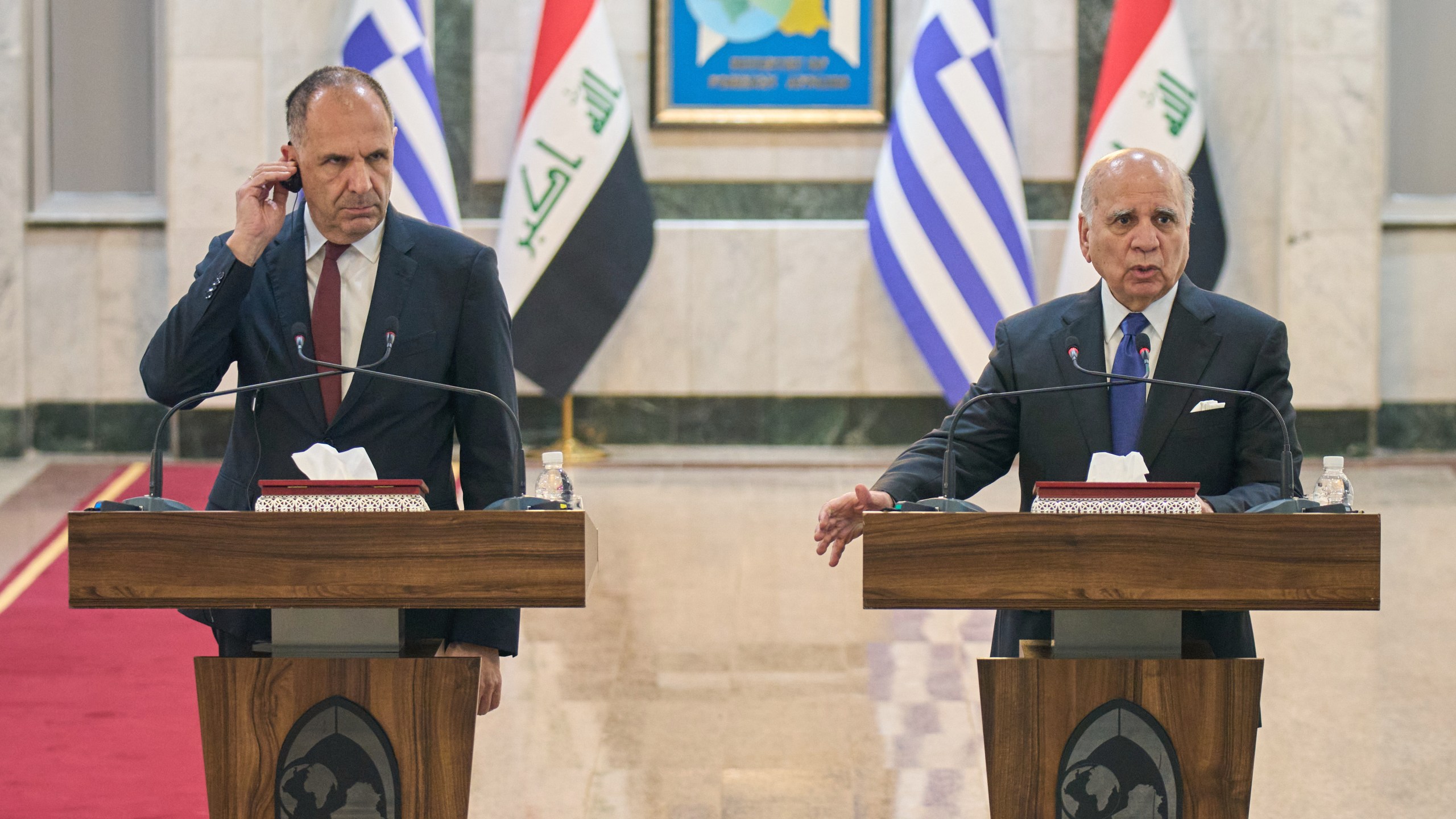 Greek Foreign Minister George Gerapetritis, left, listens to his Iraqi counterpart Fuad Hussein during a news conference after a meeting at the foreign ministry in Baghdad, Iraq, Thursday, Oct. 30, 2025. (AP Photo/Hadi Mizban)