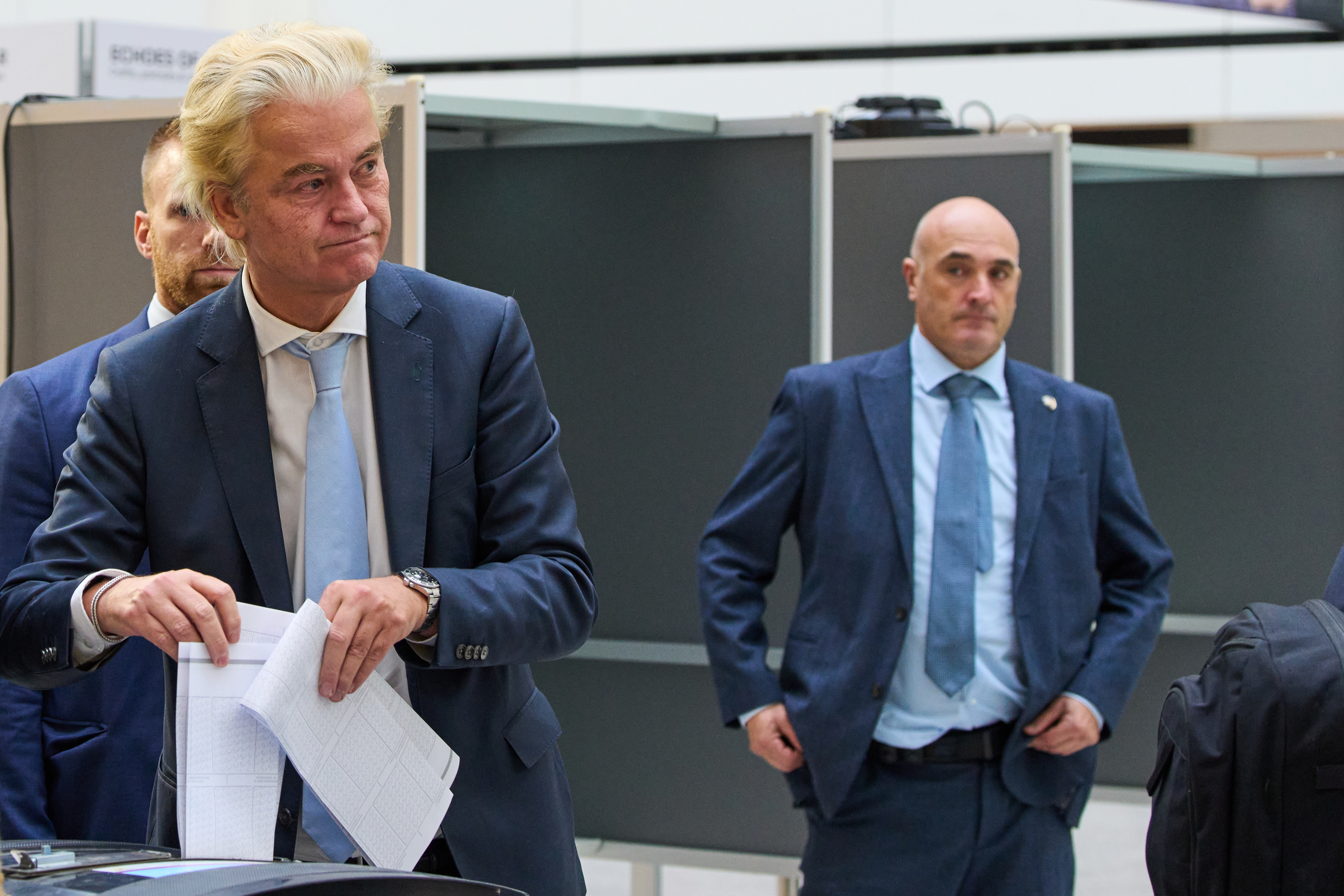 Far-right anti Islam lawmaker Geert Wilders, second left, casts his vote at a polling station during general elections in The Hague, Netherlands, Wednesday, Oct. 29, 2025. (AP Photo/Peter Dejong)