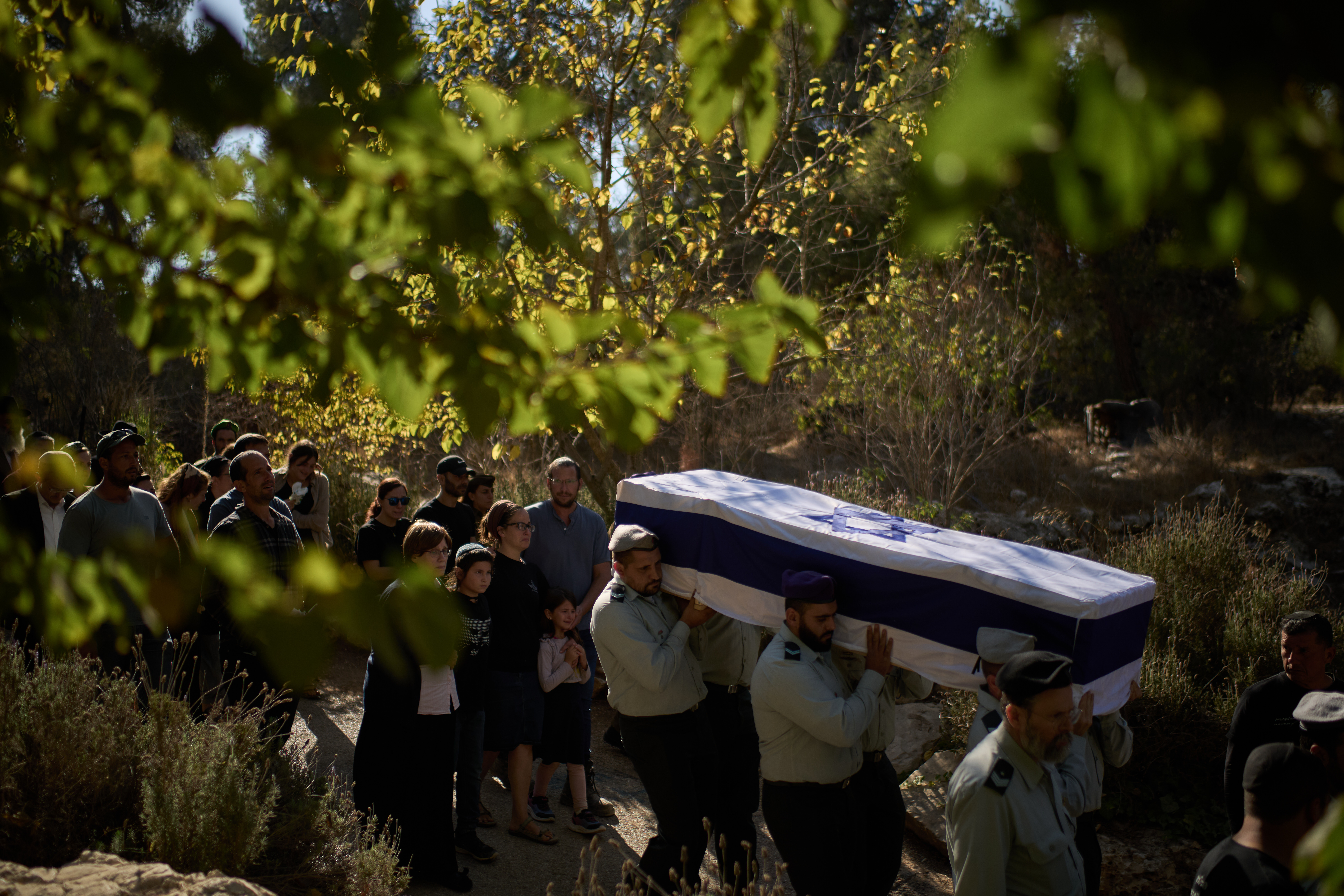 Members of Israeli defense forces carry the coffin of the reservist Master Sergeant Yona Efraim Feldbaum, who was killed in the Gaza Strip, during his funeral at Mount Herzl military cemetery, in Jersualem, Wednesday, Oct. 29, 2025. (AP Photo/Leo Correa)
