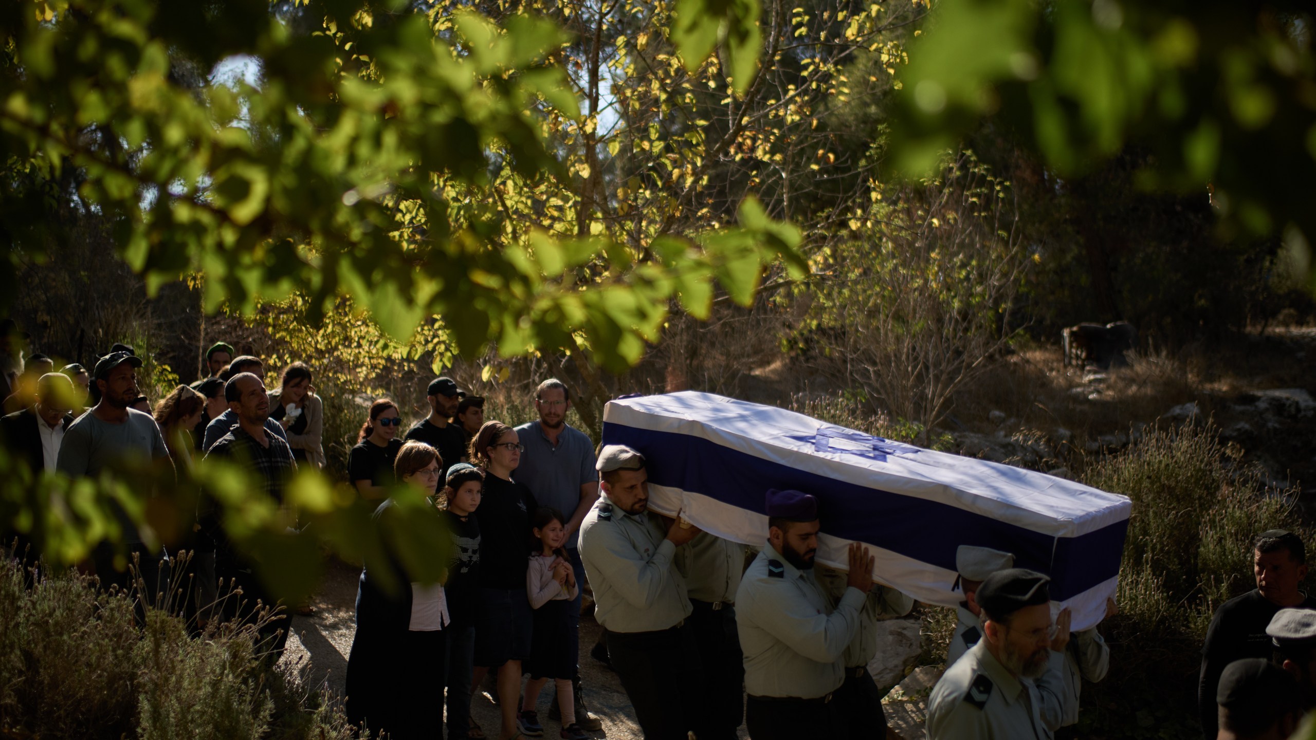 Members of Israeli defense forces carry the coffin of the reservist Master Sergeant Yona Efraim Feldbaum, who was killed in the Gaza Strip, during his funeral at Mount Herzl military cemetery, in Jersualem, Wednesday, Oct. 29, 2025. (AP Photo/Leo Correa)