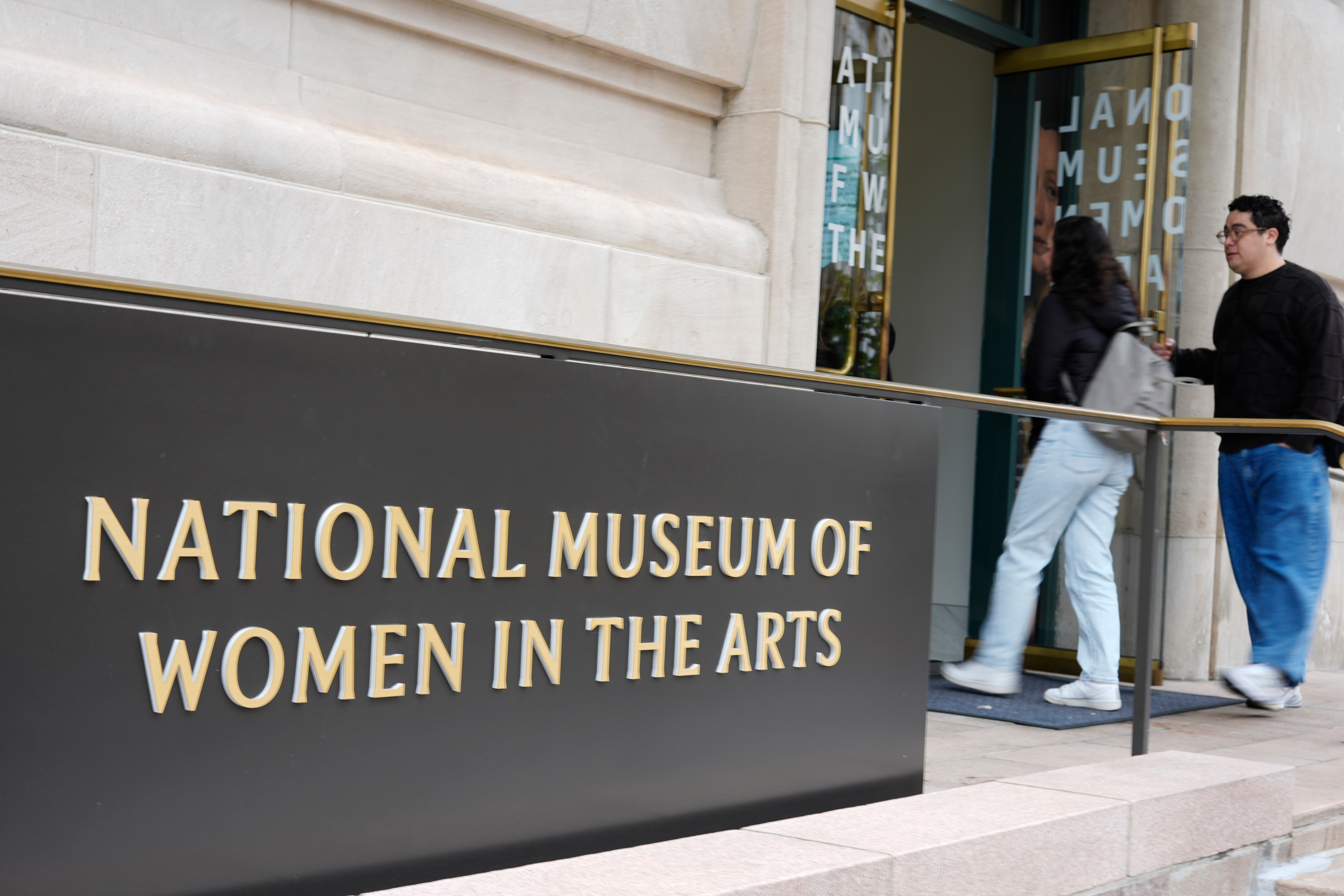 People are seen entering the main entrance to the National Museum of Women in the Arts in downtown Washington, Wednesday, Oct. 29, 2025. (AP Photo/Pablo Martinez Monsivais)