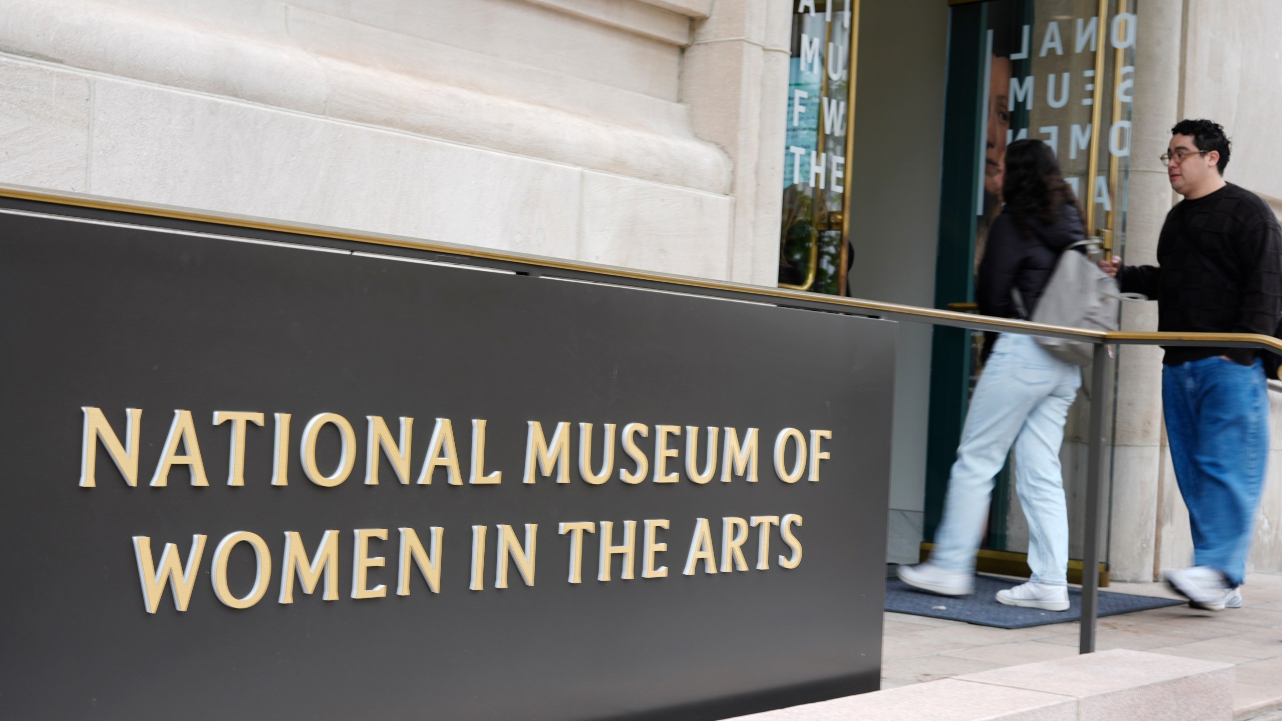 People are seen entering the main entrance to the National Museum of Women in the Arts in downtown Washington, Wednesday, Oct. 29, 2025. (AP Photo/Pablo Martinez Monsivais)