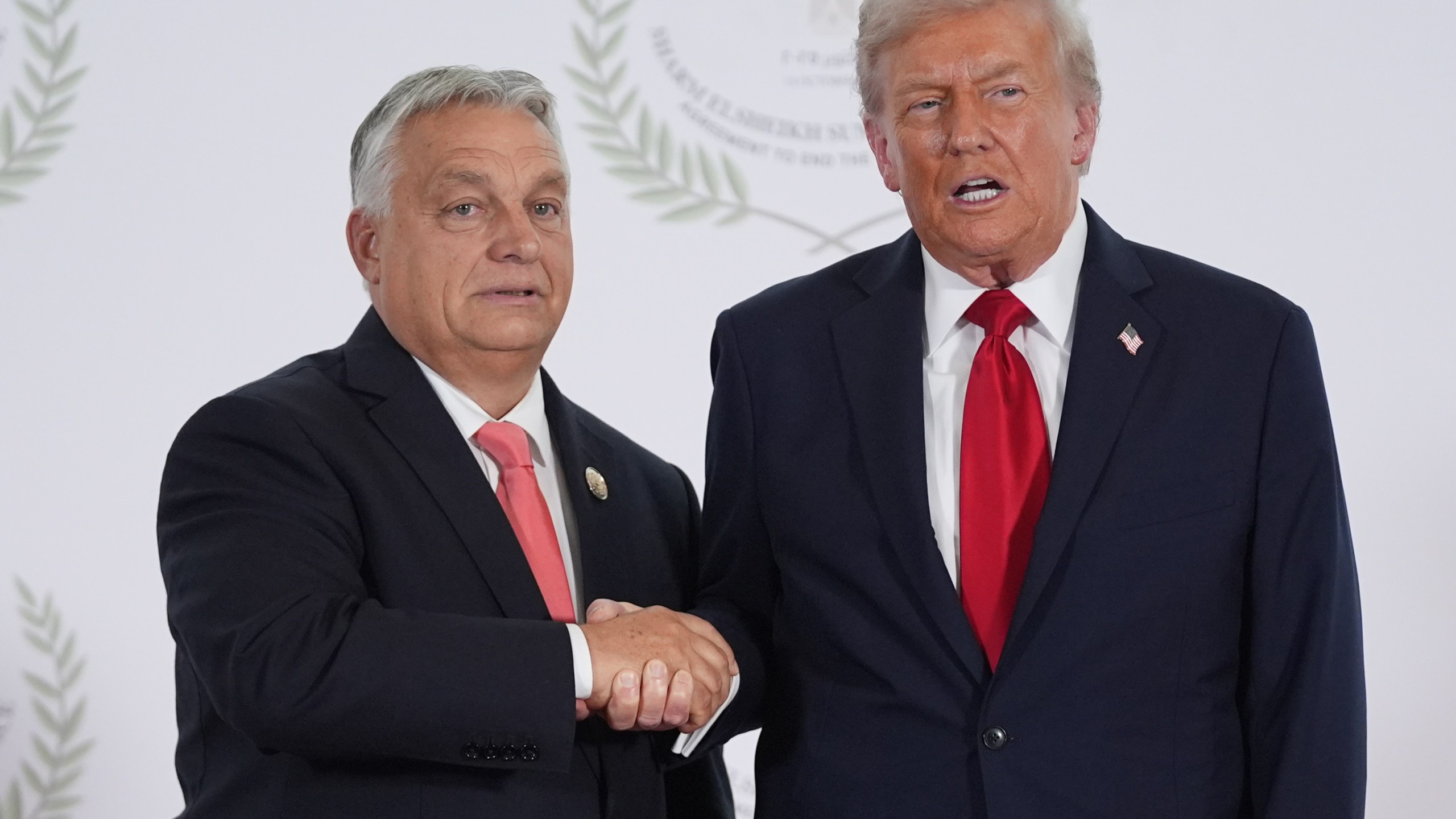 President Donald Trump greets Hungary's Prime Minister Viktor Orban during a summit to support ending the more than two-year Israel-Hamas war in Gaza after a breakthrough ceasefire deal, Monday, Oct. 13, 2025, in Sharm El Sheikh, Egypt. (AP Photo/Evan Vucci, Pool)