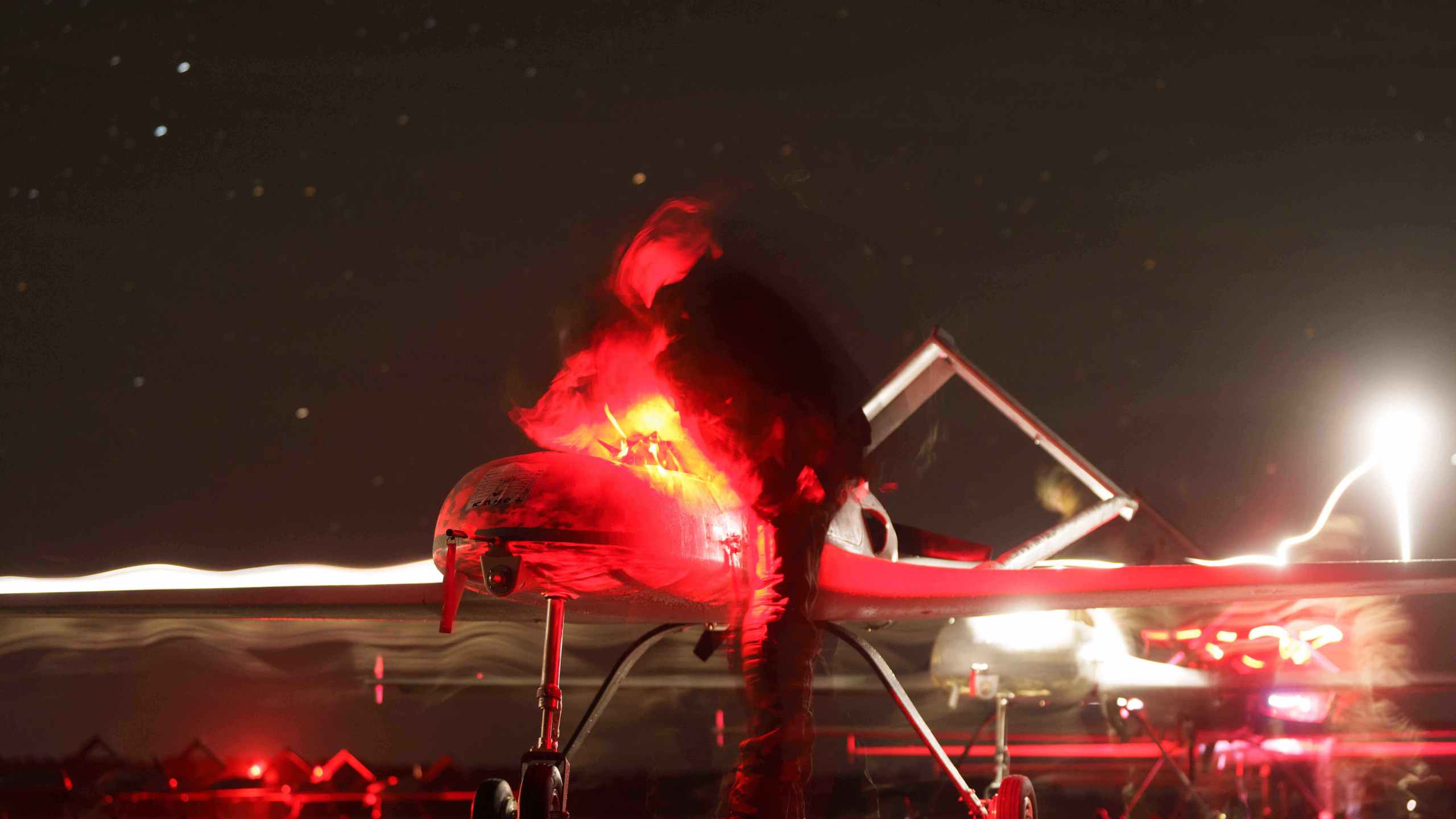 Ukrainian servicemen of the 14th Separate Unmanned Aerial Systems Regiment prepare long-range drones An-196 Liutyi before takeoff in undisclosed location, Ukraine, Tuesday, Oct. 14, 2025. (AP Photo/Evgeniy Maloletka)
