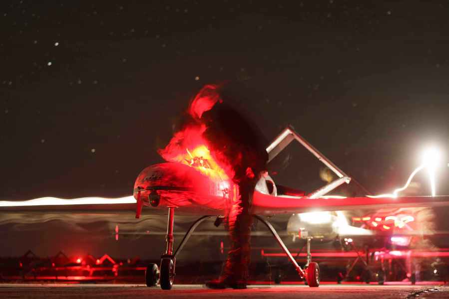 Ukrainian servicemen of the 14th Separate Unmanned Aerial Systems Regiment prepare long-range drones An-196 Liutyi before takeoff in undisclosed location, Ukraine, Tuesday, Oct. 14, 2025. (AP Photo/Evgeniy Maloletka)