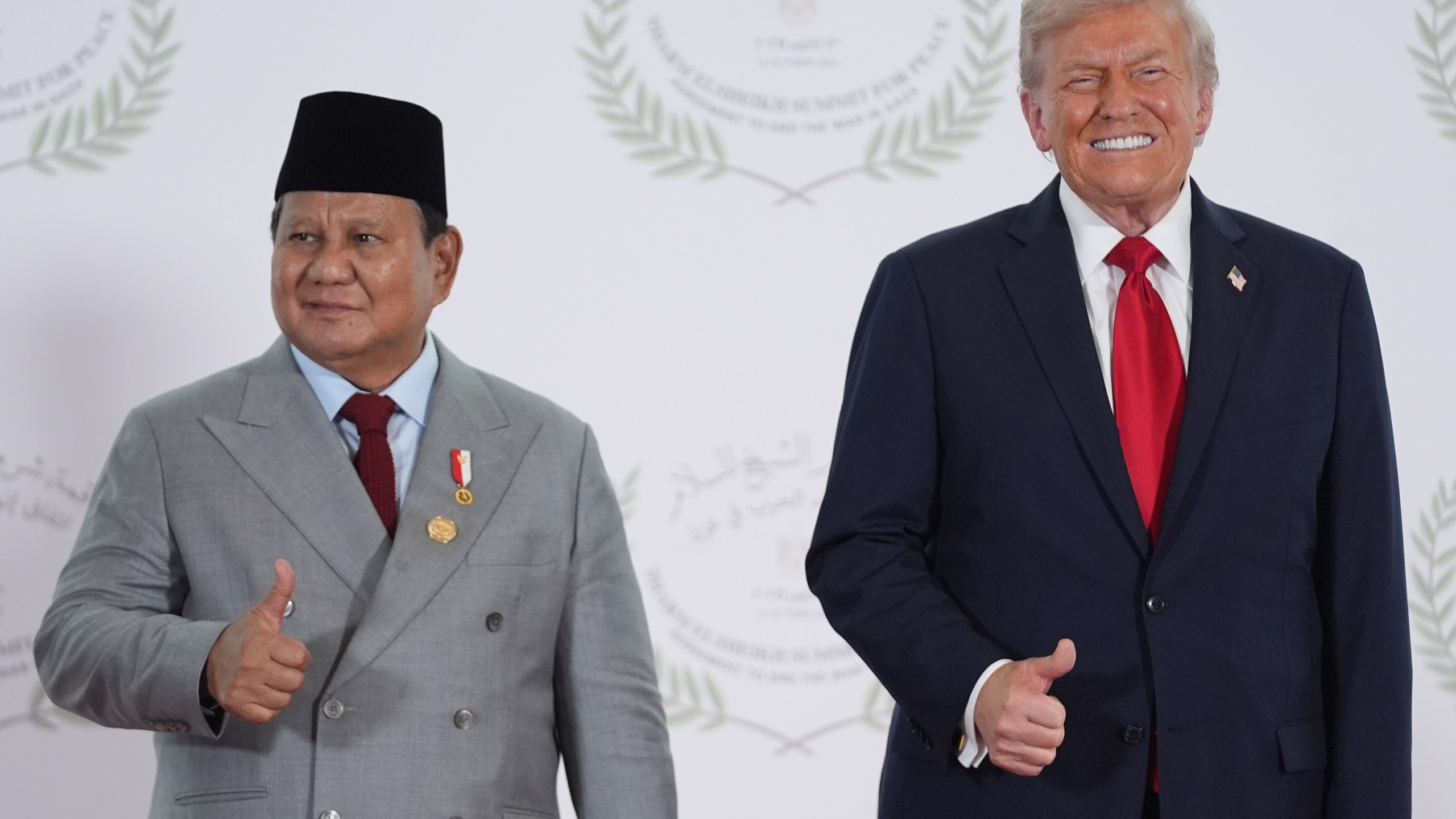 President Donald Trump greets Indonesia's President Prabowo Subianto during a summit to support ending the more than two-year Israel-Hamas war in Gaza after a breakthrough ceasefire deal, Monday, Oct. 13, 2025, in Sharm El Sheikh, Egypt. (AP Photo/Evan Vucci, Pool)
