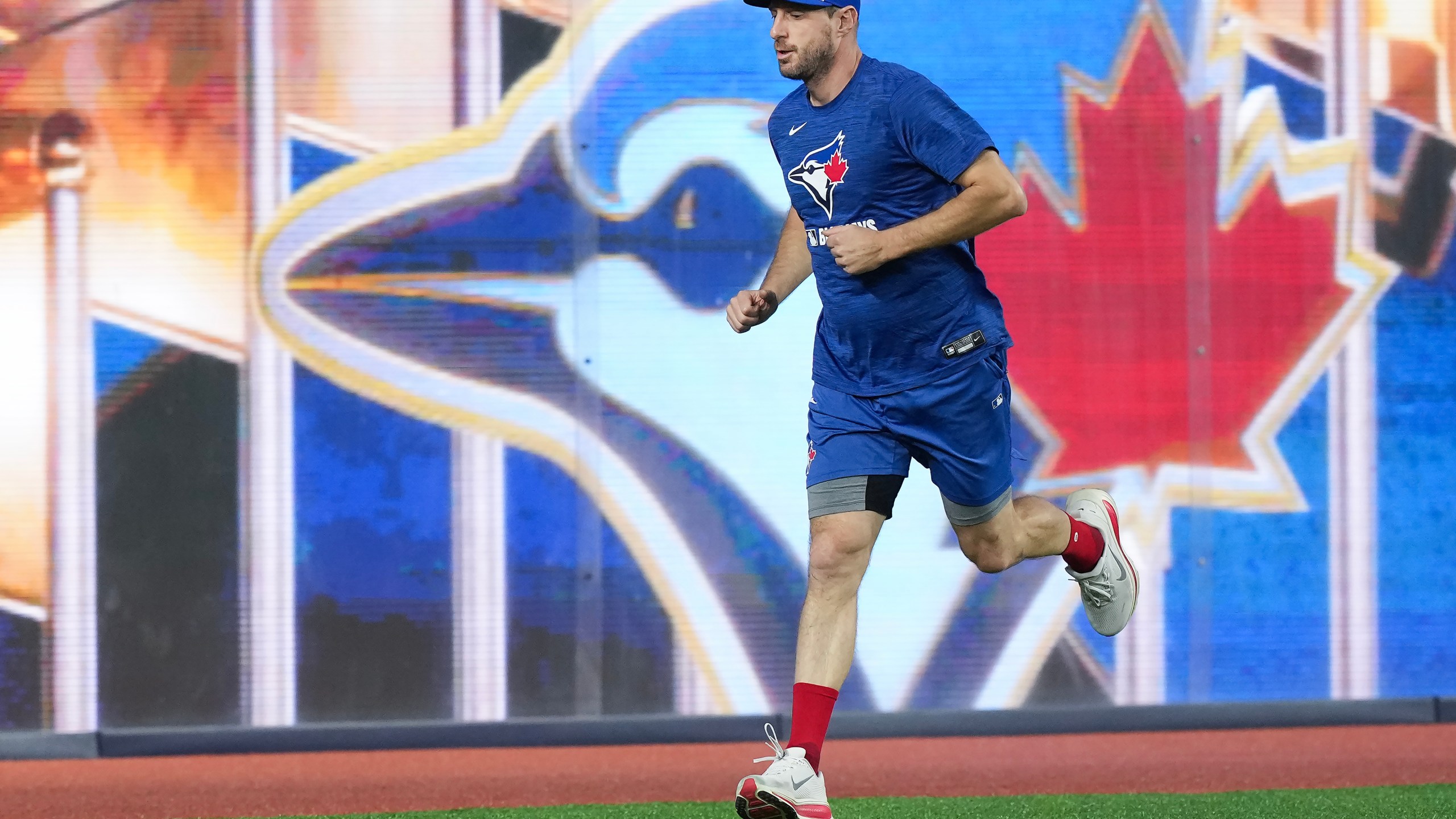 Toronto Blue Jays pitcher Max Scherzer warms up during practice ahead of game 6 of the World Series against the Los Angeles Dodgers in Toronto on Thursday, Oct. 30, 2025. (Nathan Denette/The Canadian Press via AP)