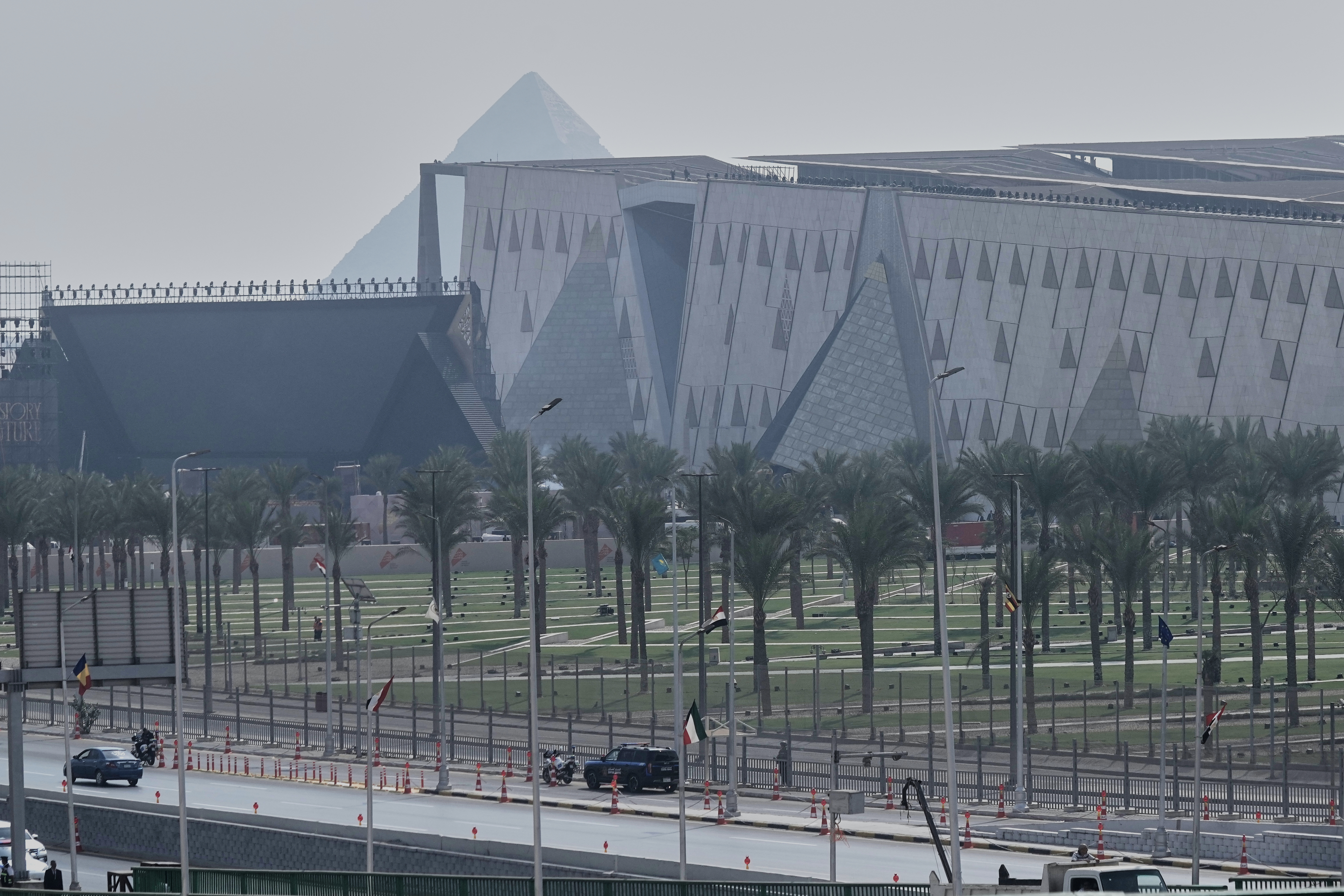 Police vehicles stand alert as they guard ahead of the opening of the Grand Egyptian Museum in Giza, Egypt, Saturday, Nov. 1, 2025. (AP Photo/Amr Nabil)