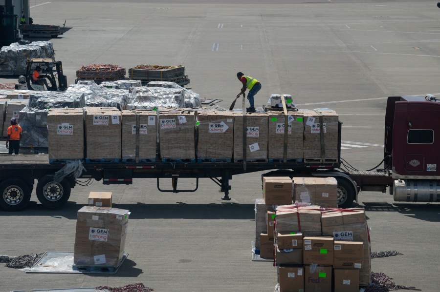 A worker unloads humanitarian aid at the Norman Manley International Airport in Kingston, Jamaica, Saturday, Nov. 1, 2025, in the aftermath of Hurricane Melissa. (AP Photo/Matias Delacroix)