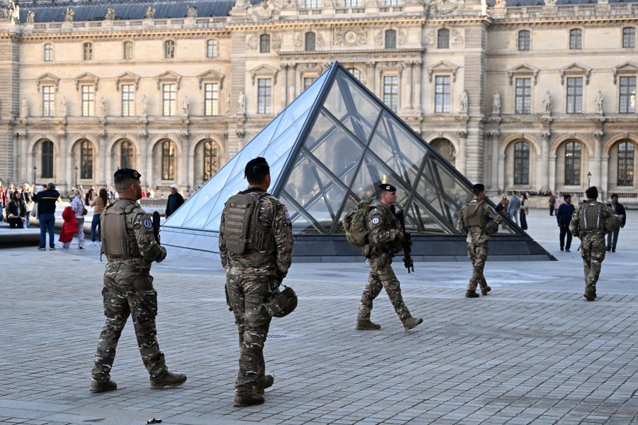 Soldiers patrol in the courtyard of the Louvre museum, Thursday, Oct. 30, 2025 in Paris. (AP Photo/Emma Da Silva)
