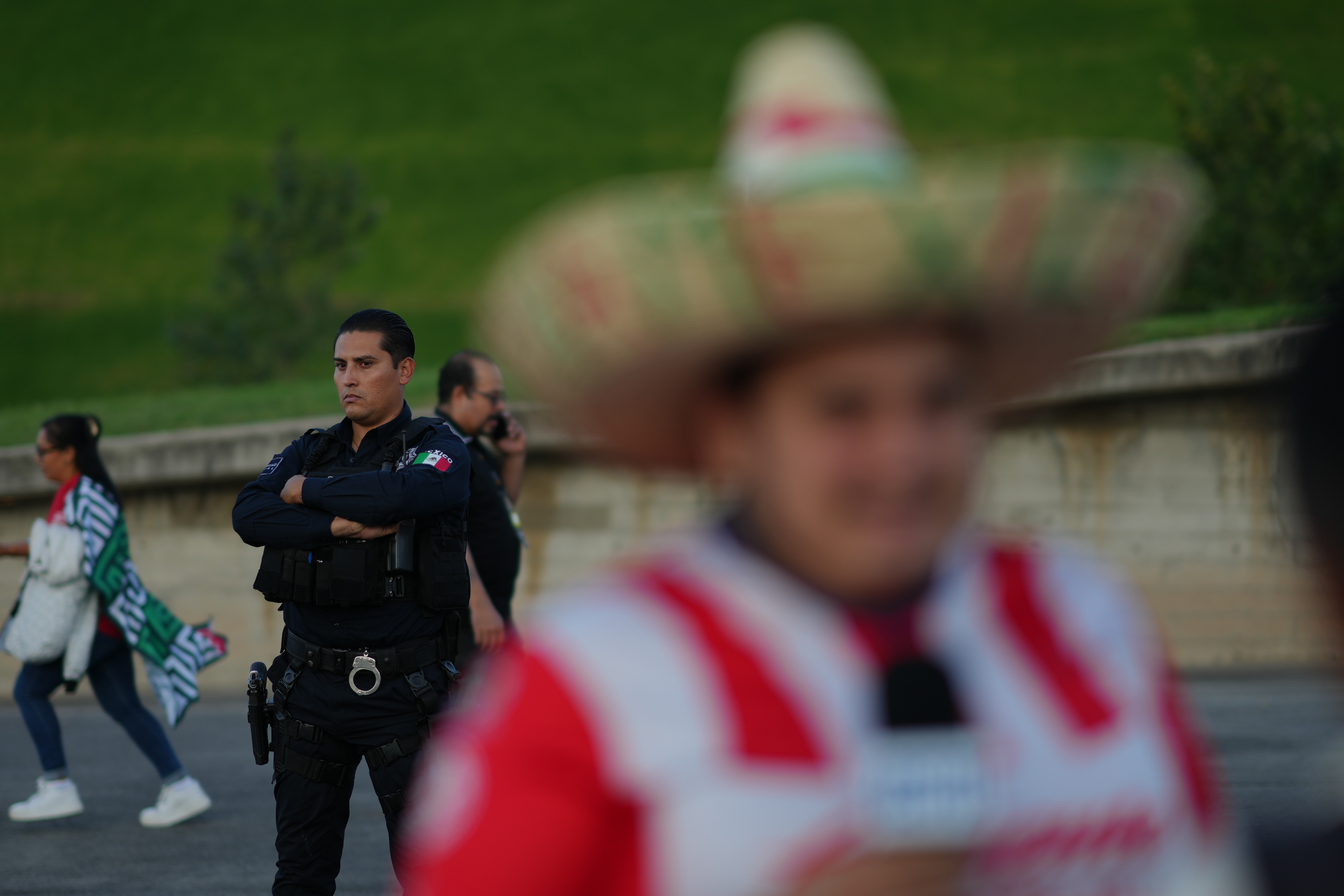 A police officer stands guard outside Akron Stadium prior to a friendly match between Mexico and Ecuador in Guadalajara, Mexico, Tuesday, Oct. 14, 2025. (AP Photo/Eduardo Verdugo)