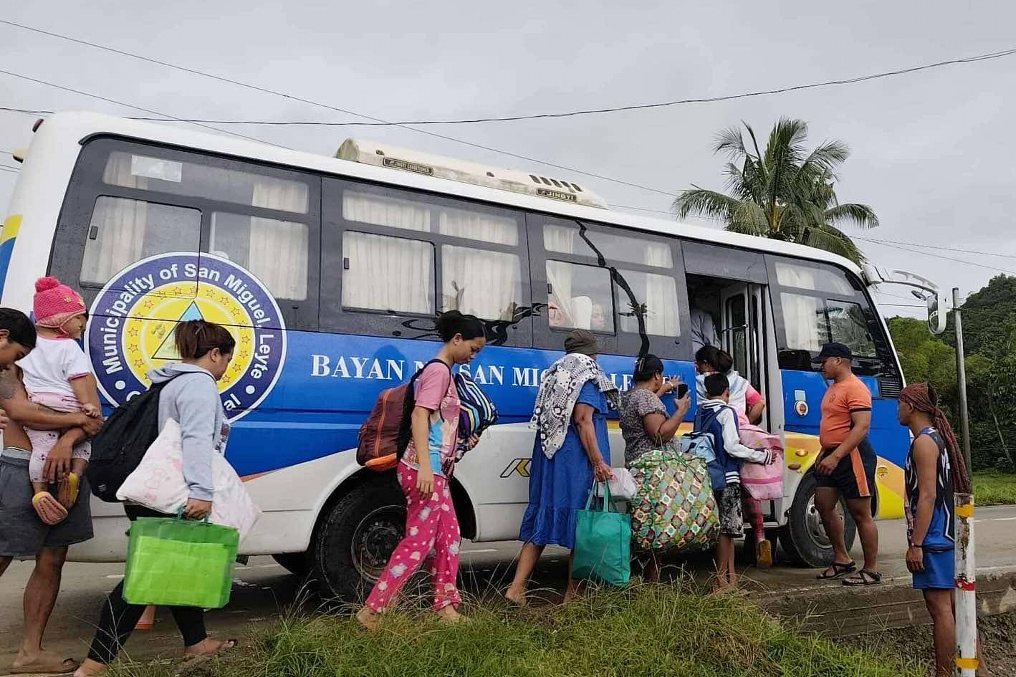 In this photo provided by the Philippine Coast Guard, residents are evacuated to safer grounds as Typhoon Kalmaegi nears the area of San Miguel, Leyte province, Philippines on Monday Nov. 3, 2025. (Philippine Coast Guard via AP)