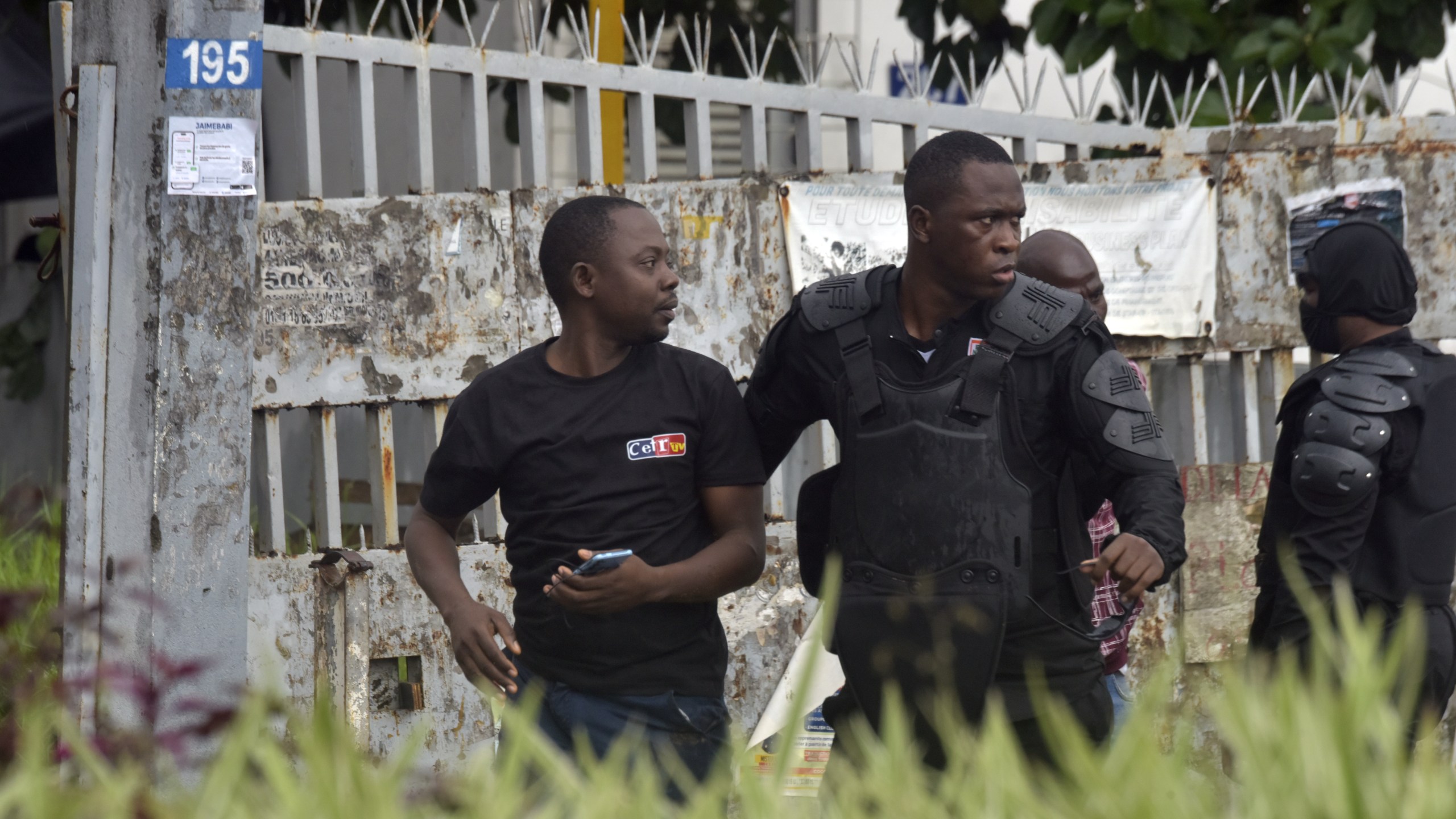 Police arrest a protester during clashes with opposition supporters in Abidjan, Ivory Coast, Saturday, Oct. 11, 2025 (AP Photo/Diomande Ble Blonde)