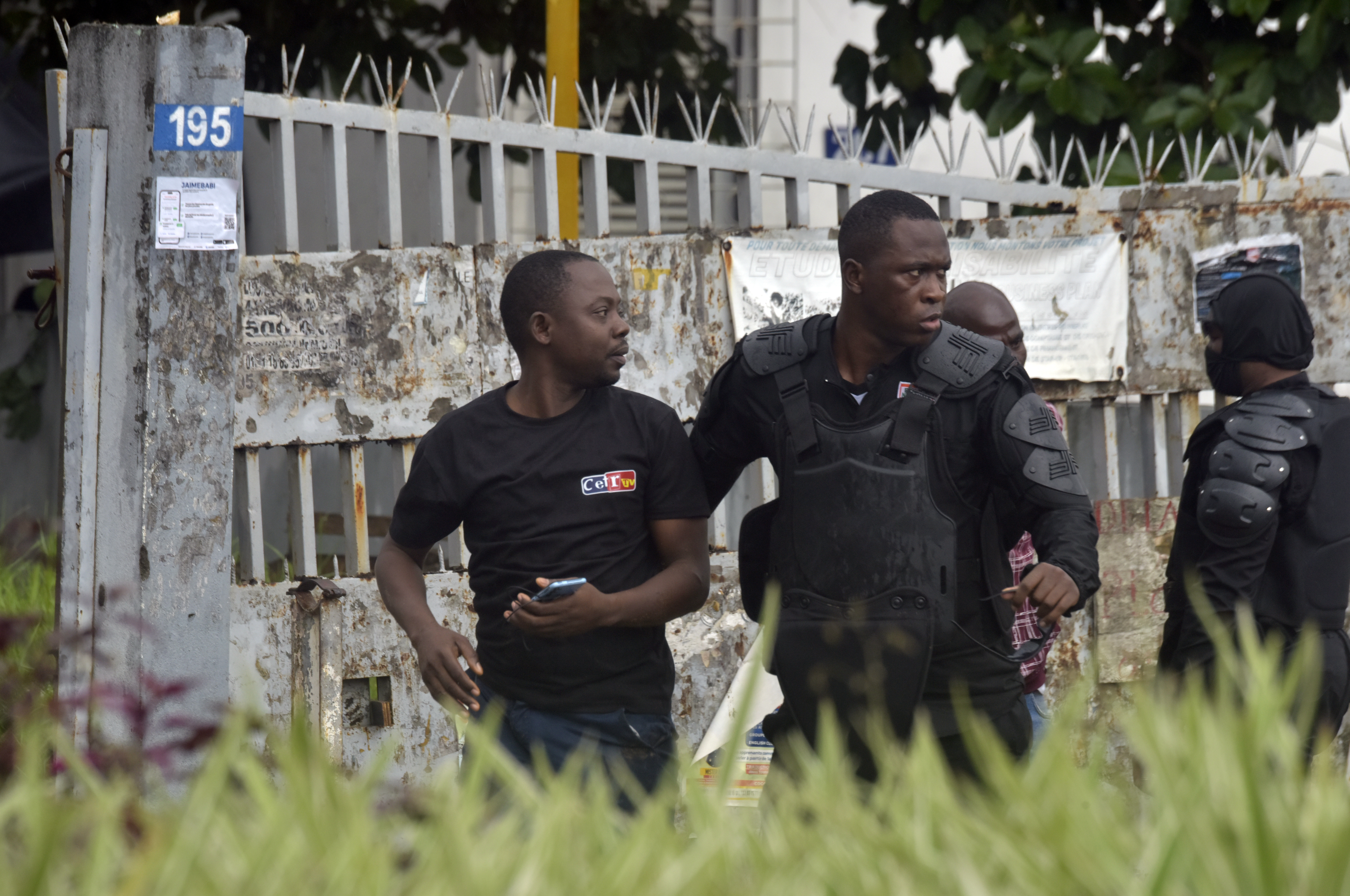 Police arrest a protester during clashes with opposition supporters in Abidjan, Ivory Coast, Saturday, Oct. 11, 2025 (AP Photo/Diomande Ble Blonde)