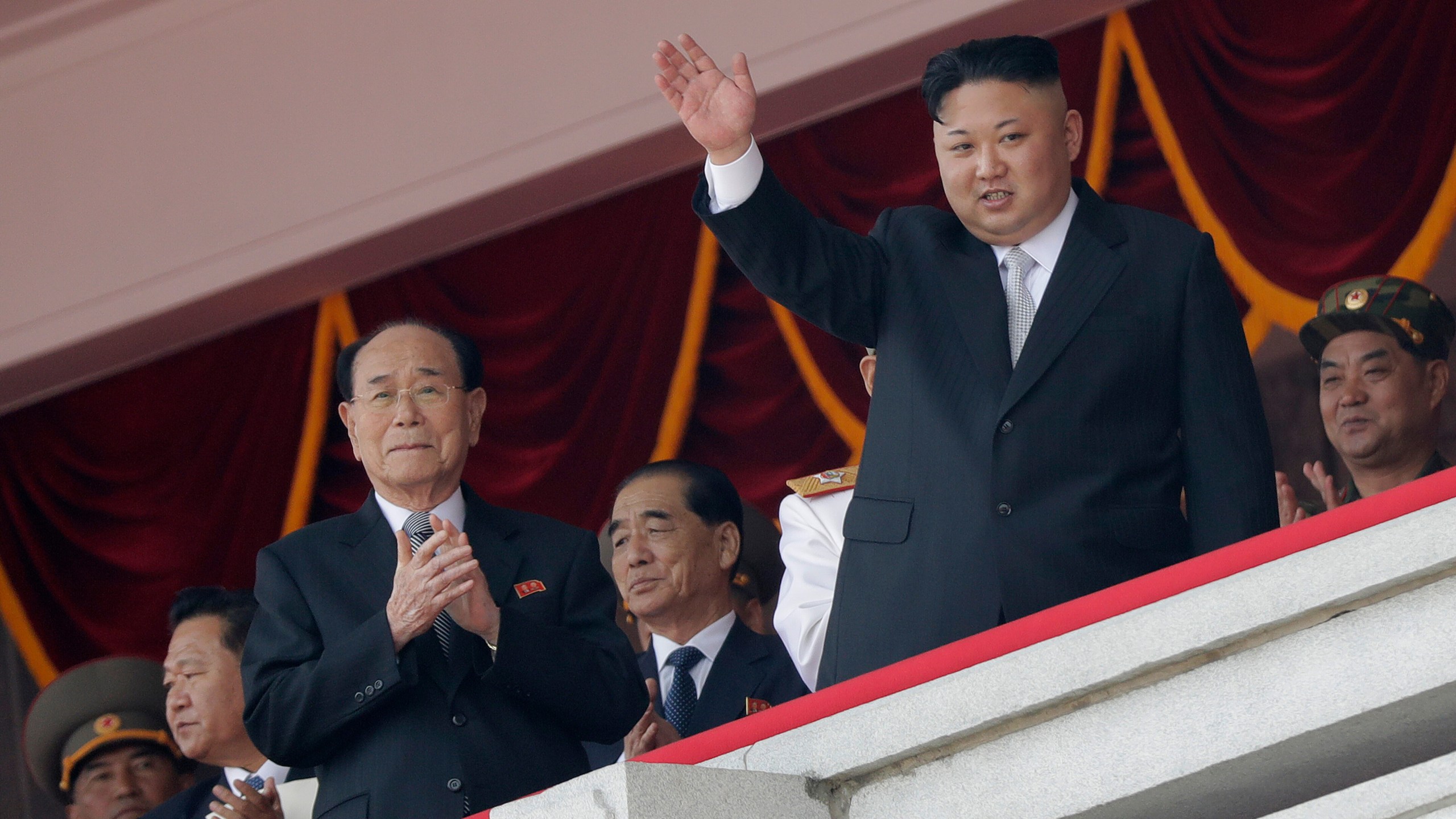FILE - North Korean leader Kim Jong Un, right, waves while Kim Yong Nam, third left, Choe Ryong Hae, second left, and Pak Pong Ju, center, clap during a military parade April 15, 2017, in Pyongyang, North Korea to celebrate the 105th birth anniversary of Kim Il Sung, the country's late founder and grandfather of current ruler Kim Jong Un. (AP Photo/Wong Maye-E, File)