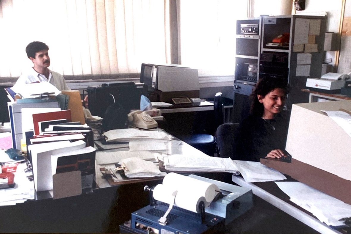 This handout photo provided by Hasan Mroue, shows Mona Ziade, right, and newsman Hasan Mroue work at the AP Middle East head office in Nicosia, Cyprus in the late 1980s. (Hasan Mroue via AP)