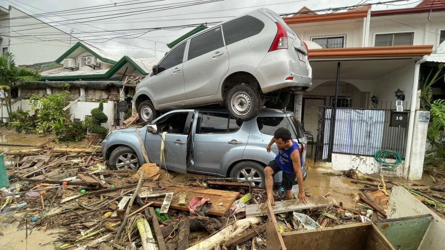 Vehicles lie piled on after flooding caused by Typhoon Kalmaegi in Cebu city, central Philippines, Tuesday, Nov. 4, 2025. (AP Photo/Jacqueline Hernandez)