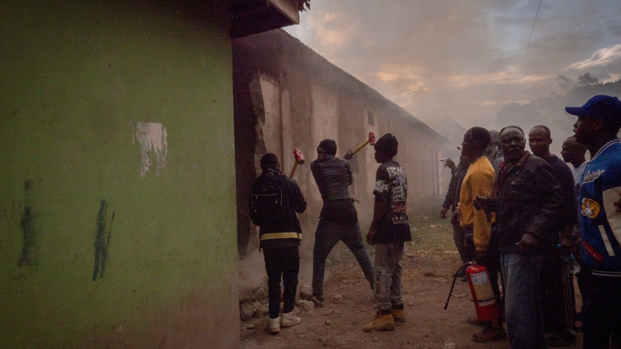 People demolish a structure during protests in Arusha, Tanzania, on election day, Wednesday, Oct. 29, 2025. (AP Photo)