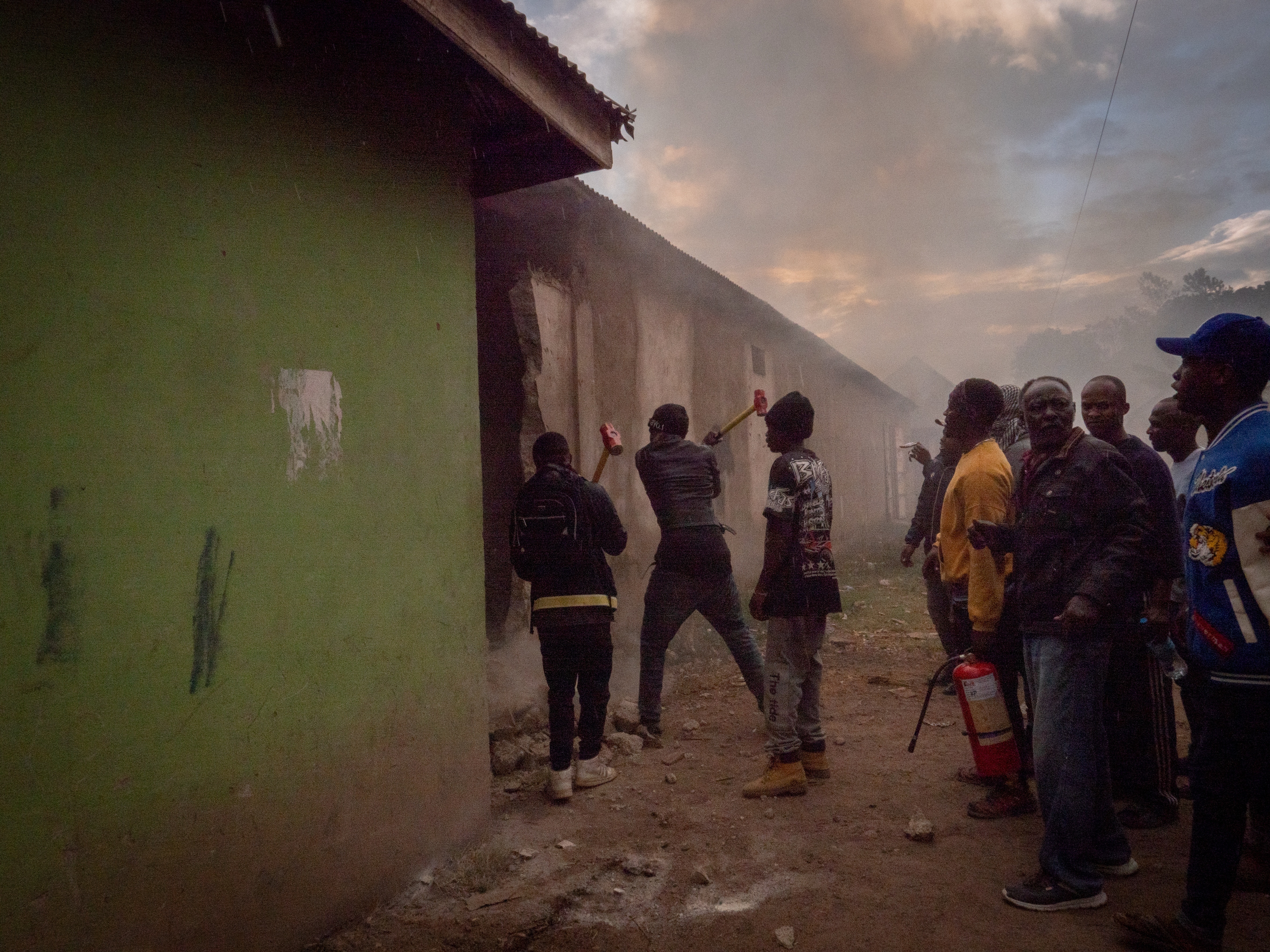 People demolish a structure during protests in Arusha, Tanzania, on election day, Wednesday, Oct. 29, 2025. (AP Photo)