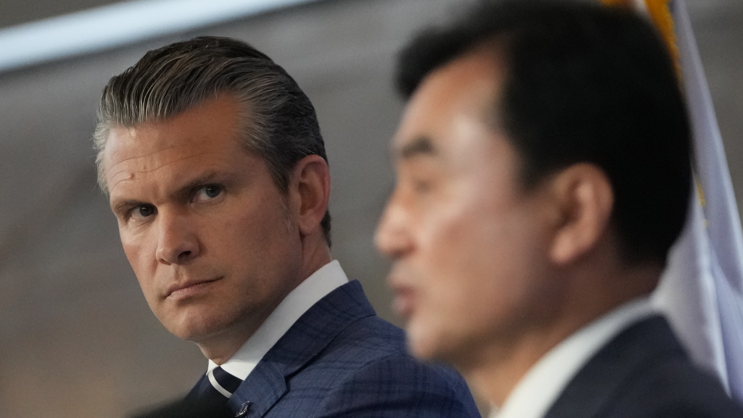 U.S. Defense Secretary Pete Hegseth, left, looks on as South Korean Defense Minister Ahn Gyu-back, right, speaks during the joint press conference following the 57th Security Consultative Meeting at the Defense Ministry in Seoul, South Korea, Tuesday, Nov. 4, 2025. (AP Photo/Lee Jin-man, Pool)