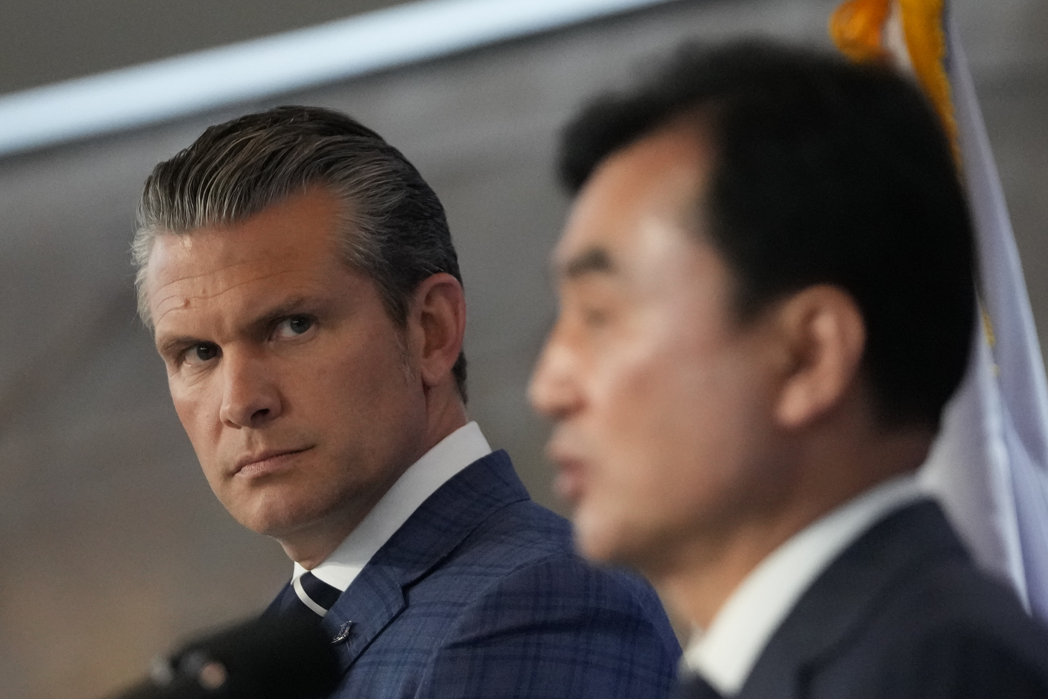 U.S. Defense Secretary Pete Hegseth, left, looks on as South Korean Defense Minister Ahn Gyu-back, right, speaks during the joint press conference following the 57th Security Consultative Meeting at the Defense Ministry in Seoul, South Korea, Tuesday, Nov. 4, 2025. (AP Photo/Lee Jin-man, Pool)
