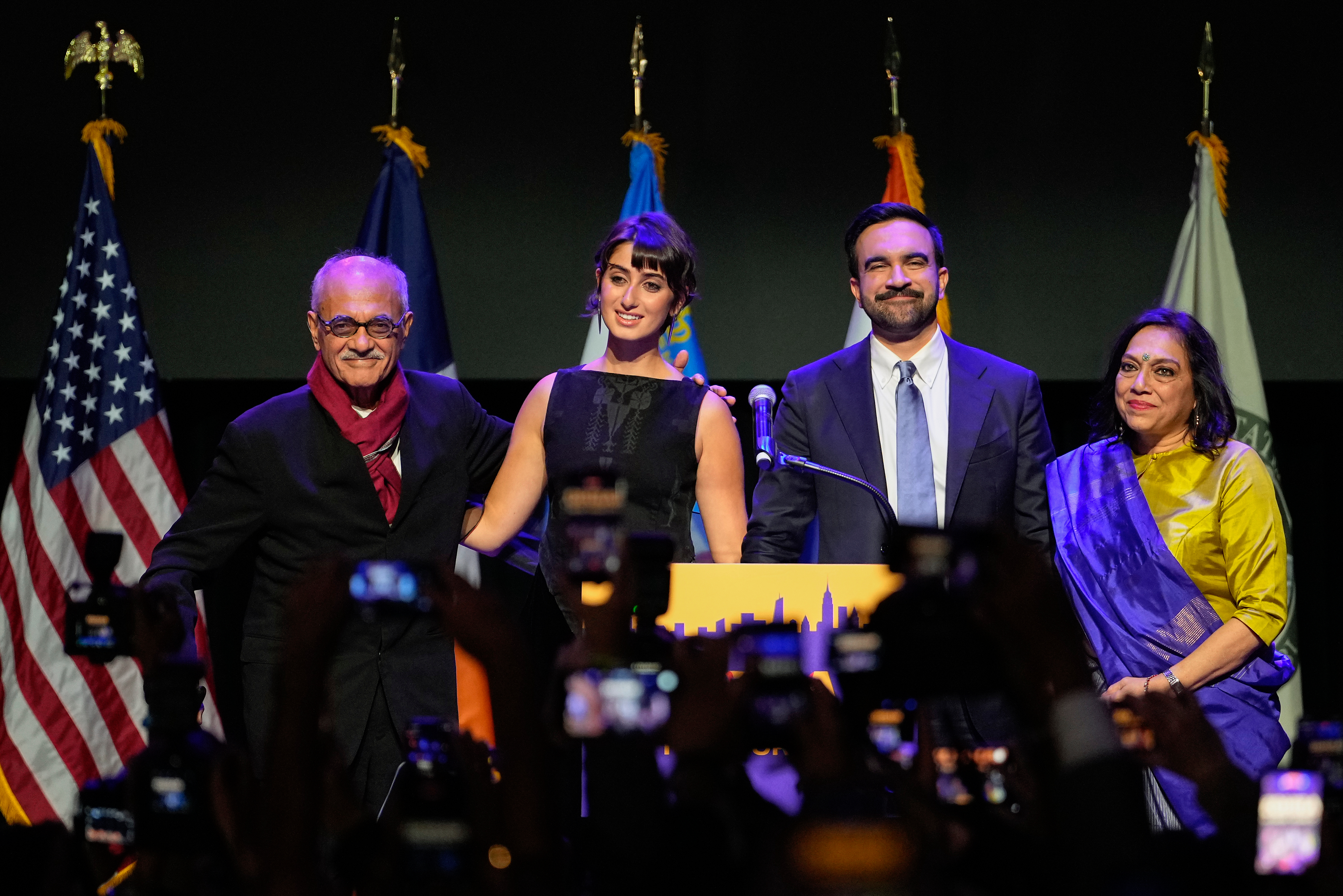 Mayor-elect Zohran Mamdani, second from right, stands on stage with his wife Rama Duwaji, second from left, and his father, Mahmood Mamdani, far left, and mother, Mira Nair, after making an acceptance speech, Tuesday, Nov. 4, 2025, in New York. (AP Photo/Yuki Iwamura)