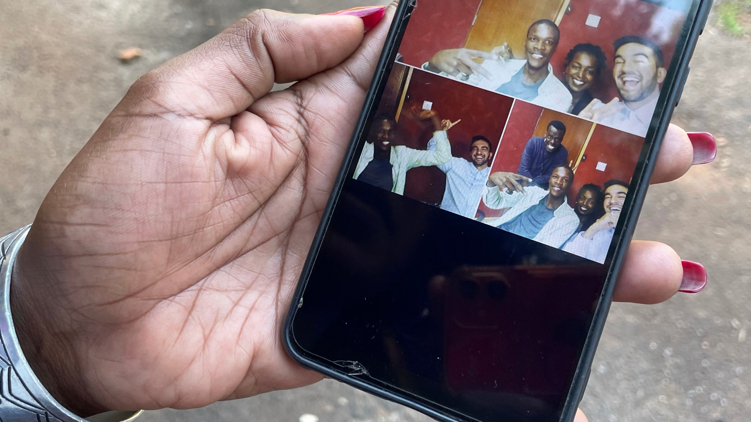 Radio host Siima Kyakuhaire Sabiti shows old pictures of her with New York Mayor-elect Zohran Mamdani during his 2019 visit to her show in Kampala, Uganda, Wednesday, Nov. 5, 2025. (AP Photo/Hajarah Nalwadda )