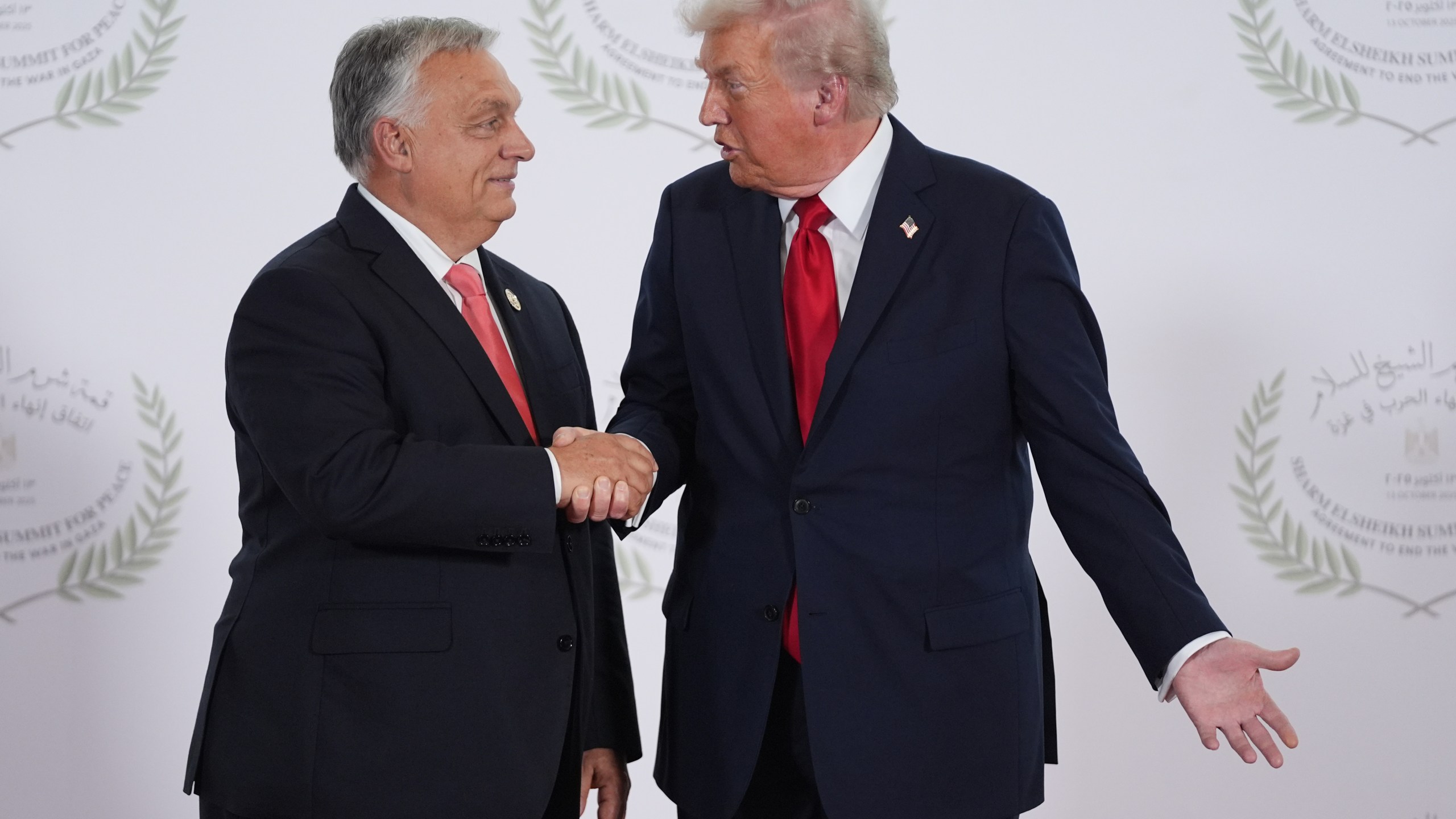 President Donald Trump greets Hungary's Prime Minister Viktor Orban during a summit to support ending the more than two-year Israel-Hamas war in Gaza after a breakthrough ceasefire deal, Monday, Oct. 13, 2025, in Sharm El Sheikh, Egypt. (AP Photo/Evan Vucci, Pool)