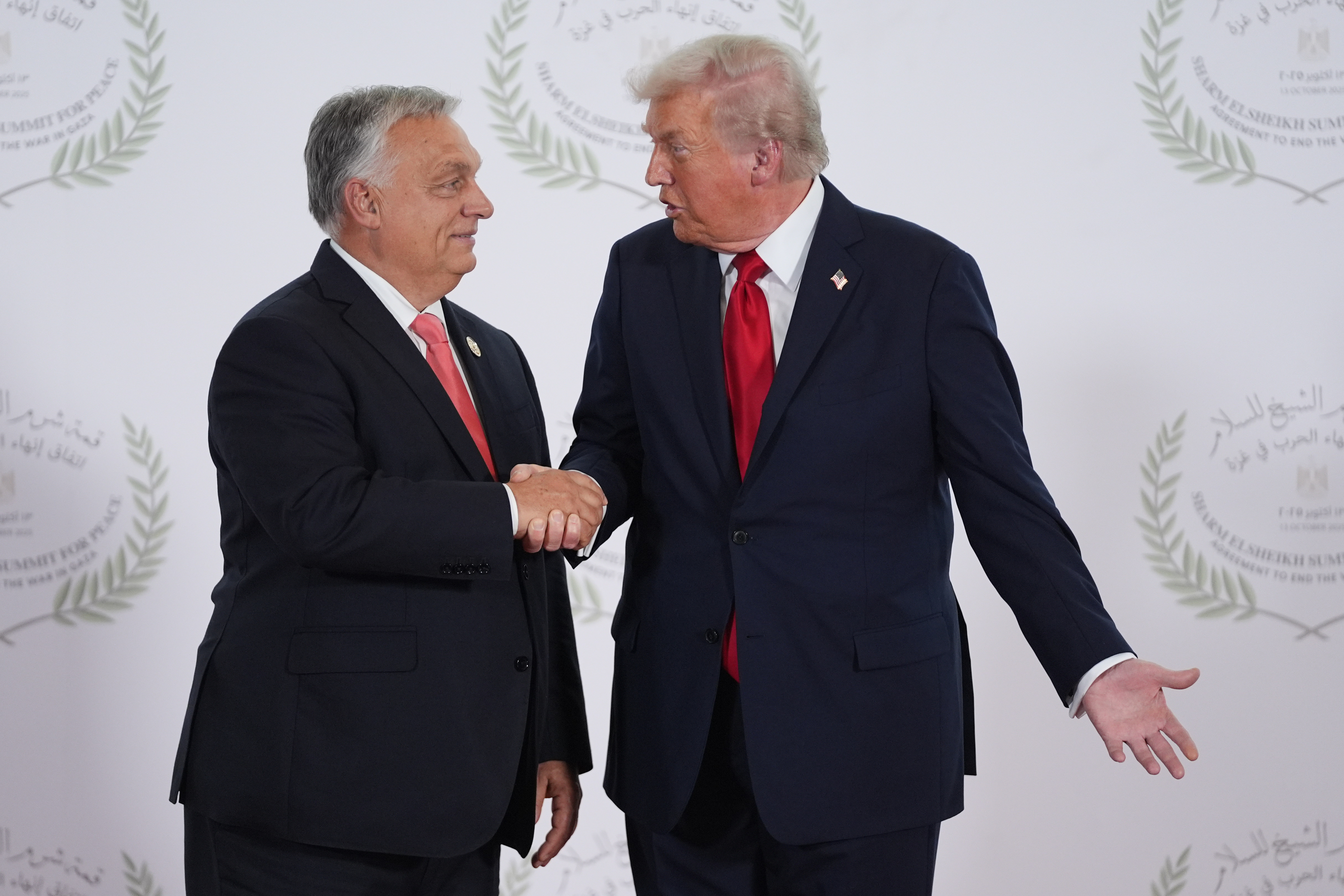 President Donald Trump greets Hungary's Prime Minister Viktor Orban during a summit to support ending the more than two-year Israel-Hamas war in Gaza after a breakthrough ceasefire deal, Monday, Oct. 13, 2025, in Sharm El Sheikh, Egypt. (AP Photo/Evan Vucci, Pool)