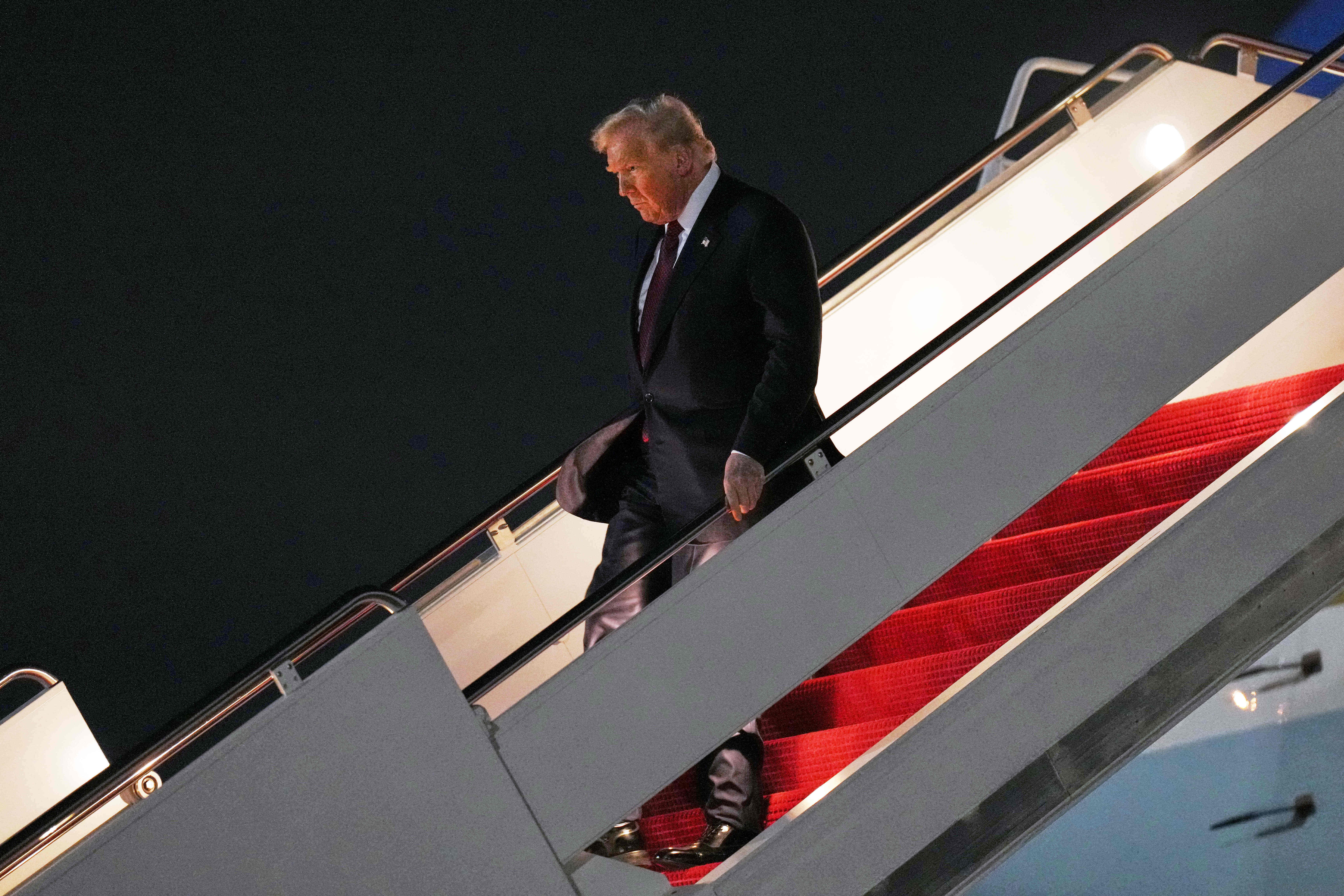 President Donald Trump walks off Air Force One, Wednesday, Nov. 5, 2025, at Joint Base Andrews, Md., after a day trip to Miami. (AP Photo/Jacquelyn Martin)