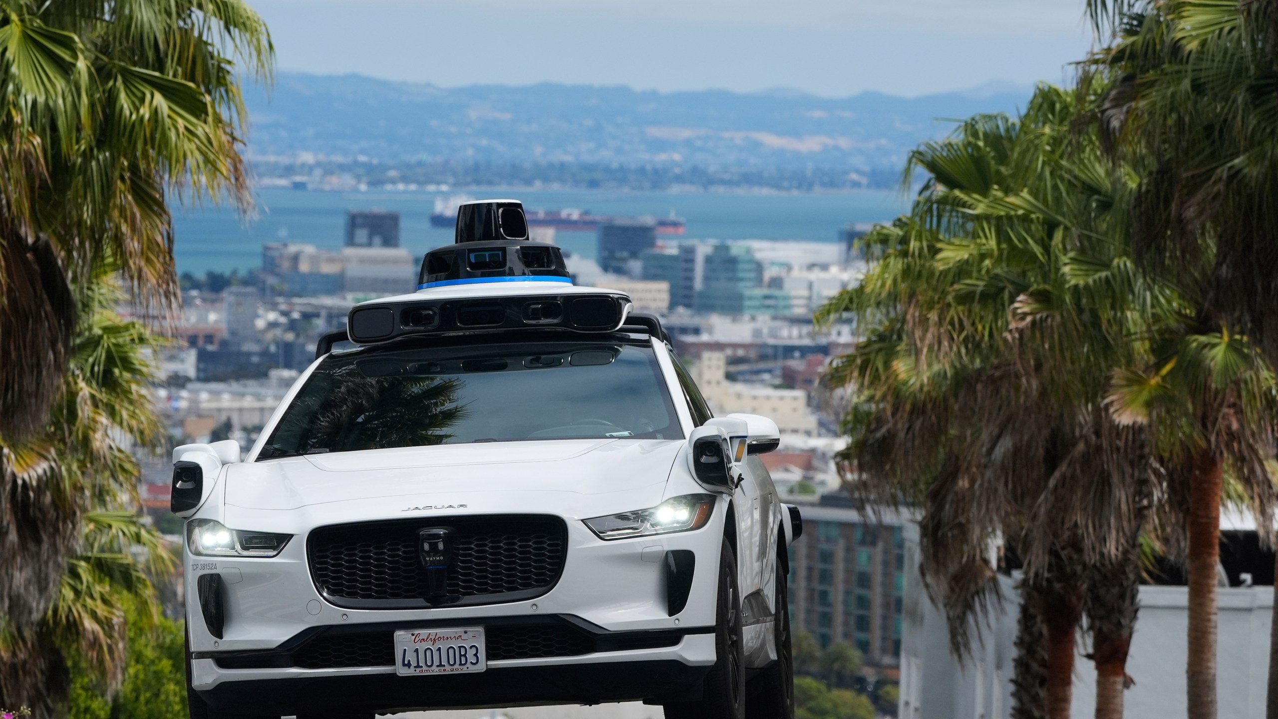 FILE - A Waymo car drives up a hill in San Francisco, Sept. 4, 2025. (AP Photo/Jeff Chiu, File)