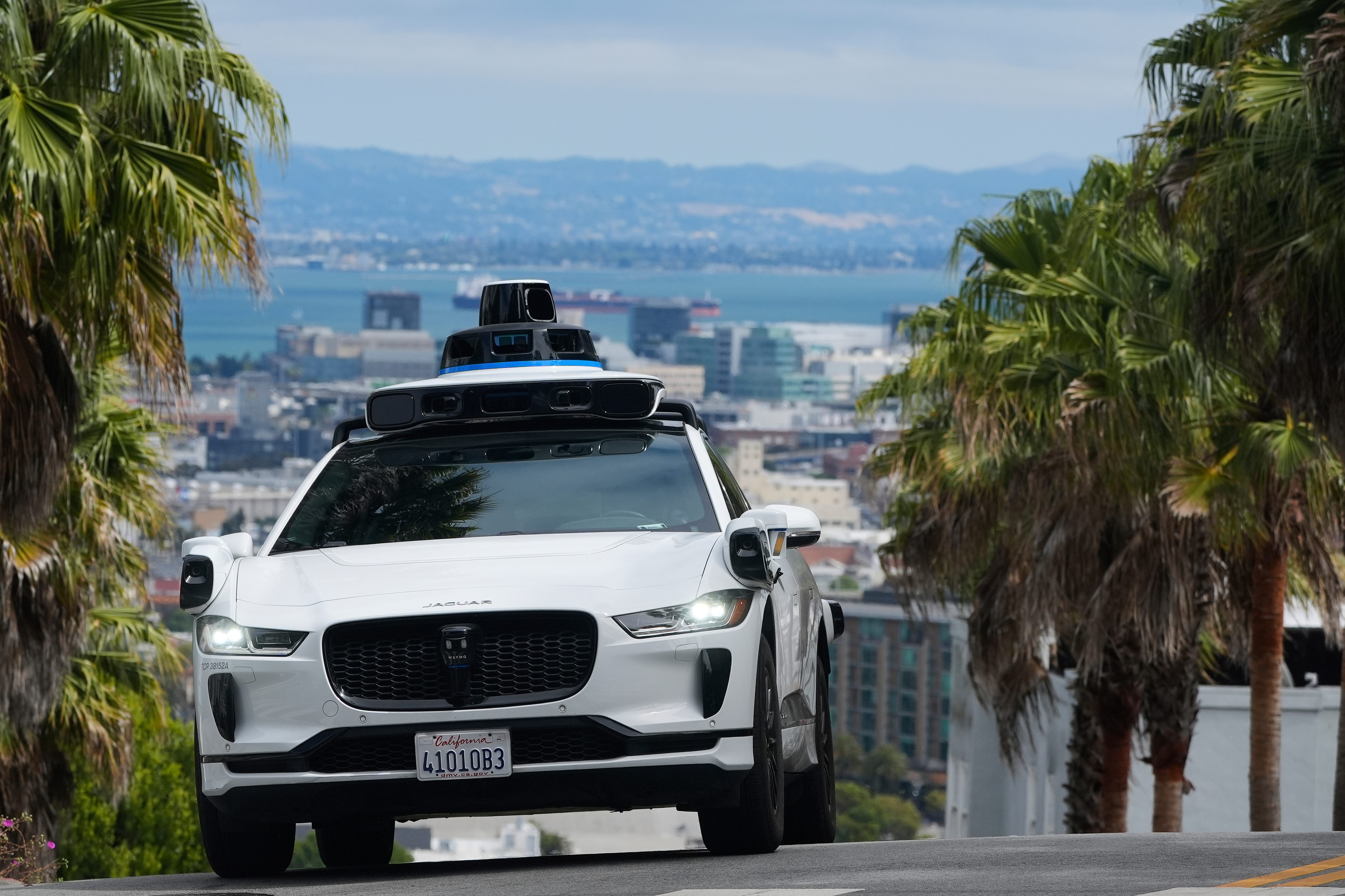 FILE - A Waymo car drives up a hill in San Francisco, Sept. 4, 2025. (AP Photo/Jeff Chiu, File)
