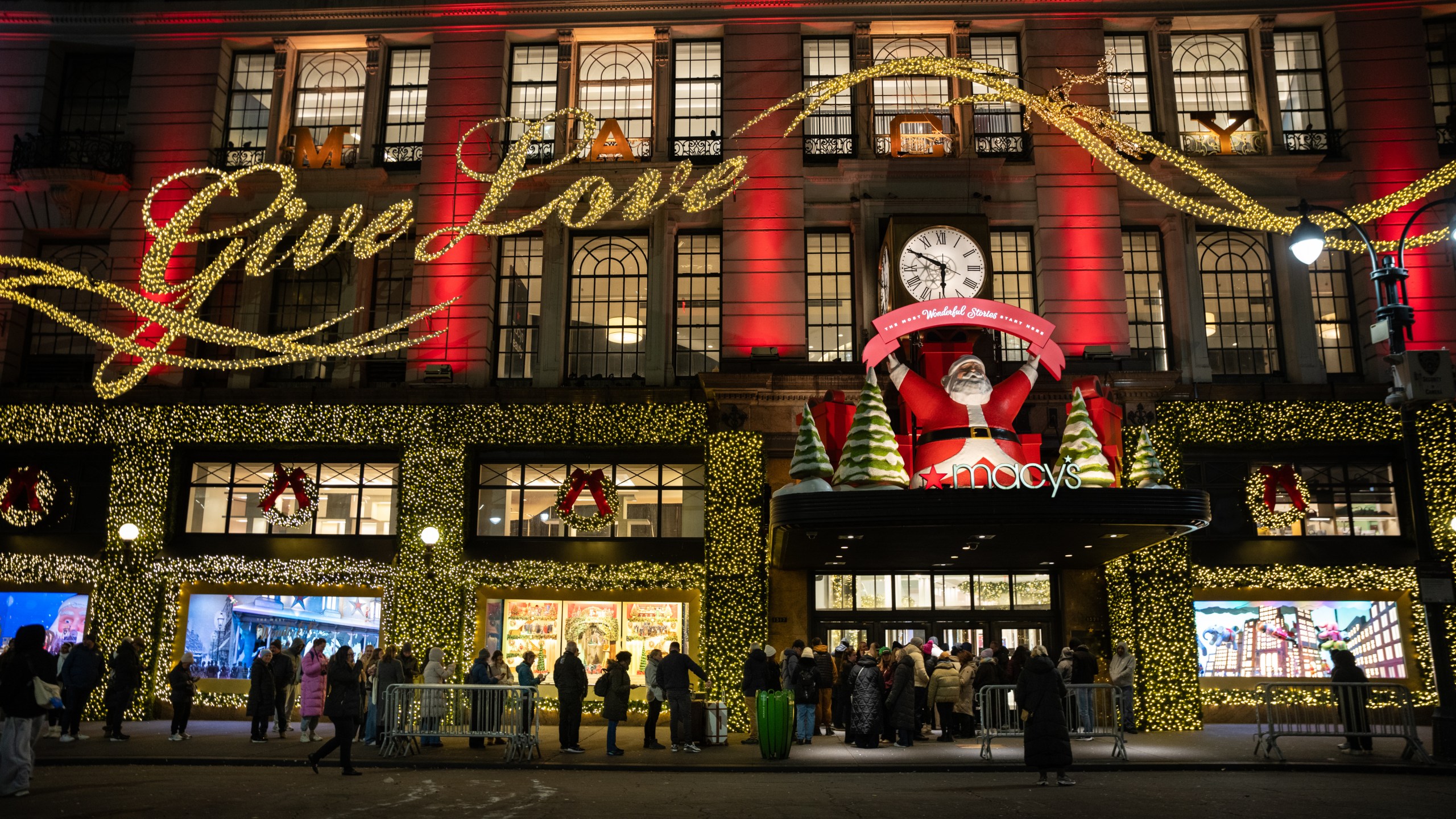 Black Friday Shoppers wait in line to enter Macy's flagship store on Friday, Nov. 28, 2025 in New York. (AP Photo/Angelina Katsanis)