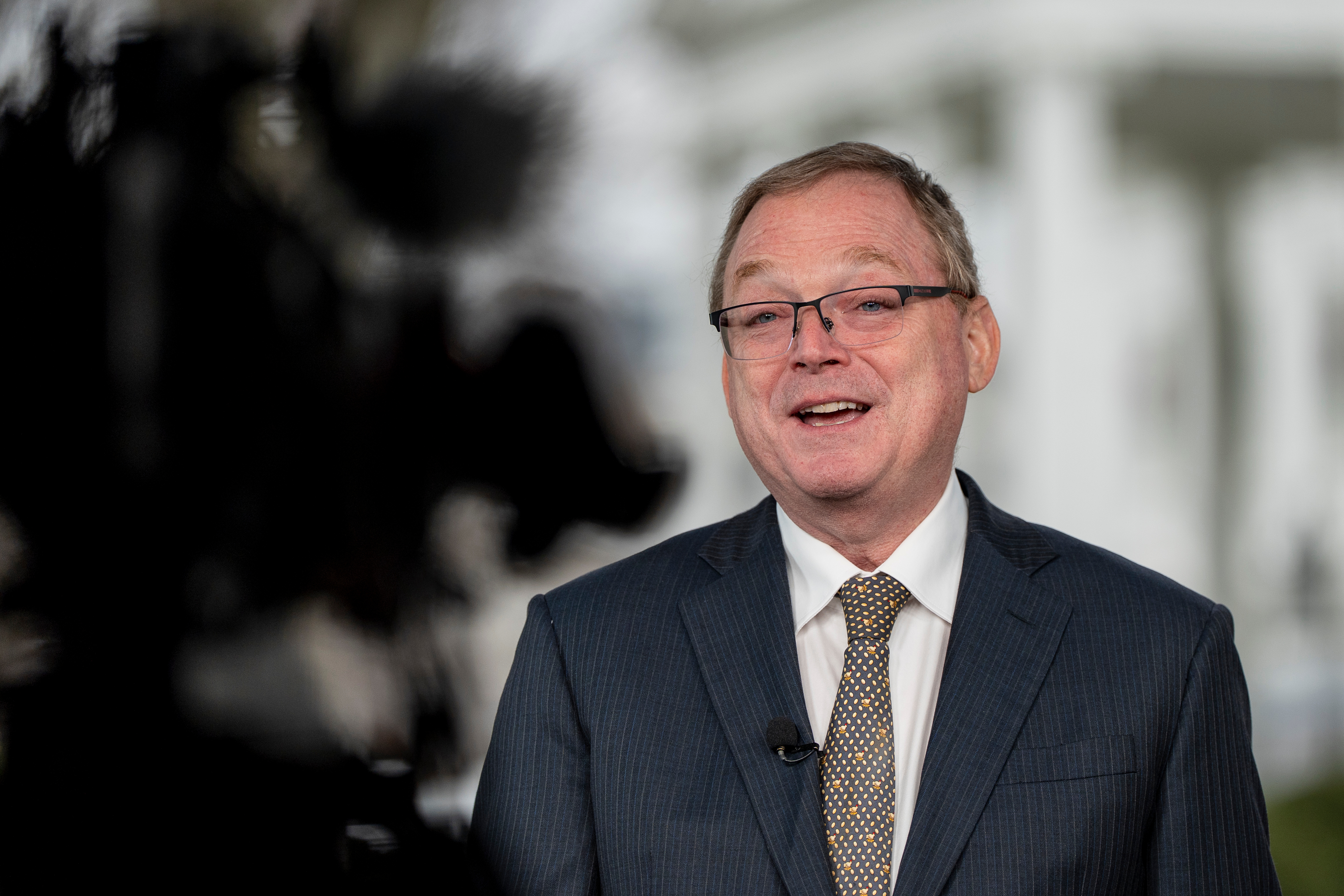 Director of the National Economic Council Kevin Hassett does a television interview at the White House, Wednesday, Dec. 10, 2025, in Washington. (AP Photo/Alex Brandon)