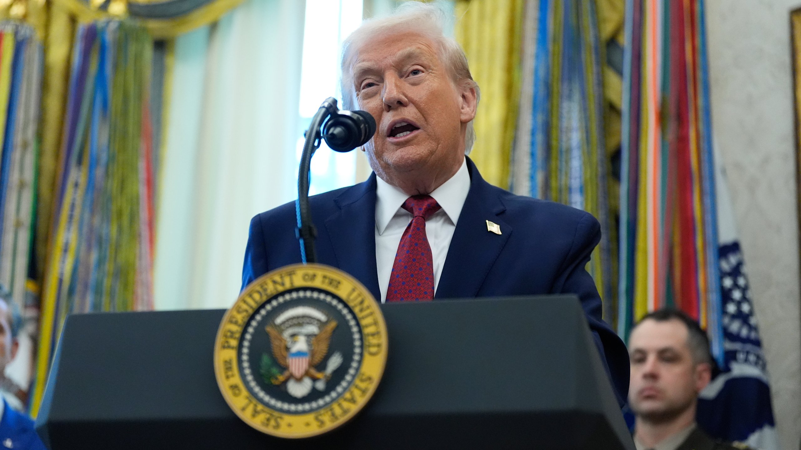 President Donald Trump speaks during a Mexican Border Defense Medal presentation in the Oval Office of the White House, Monday, Dec. 15, 2025, in Washington. (AP Photo/Alex Brandon)