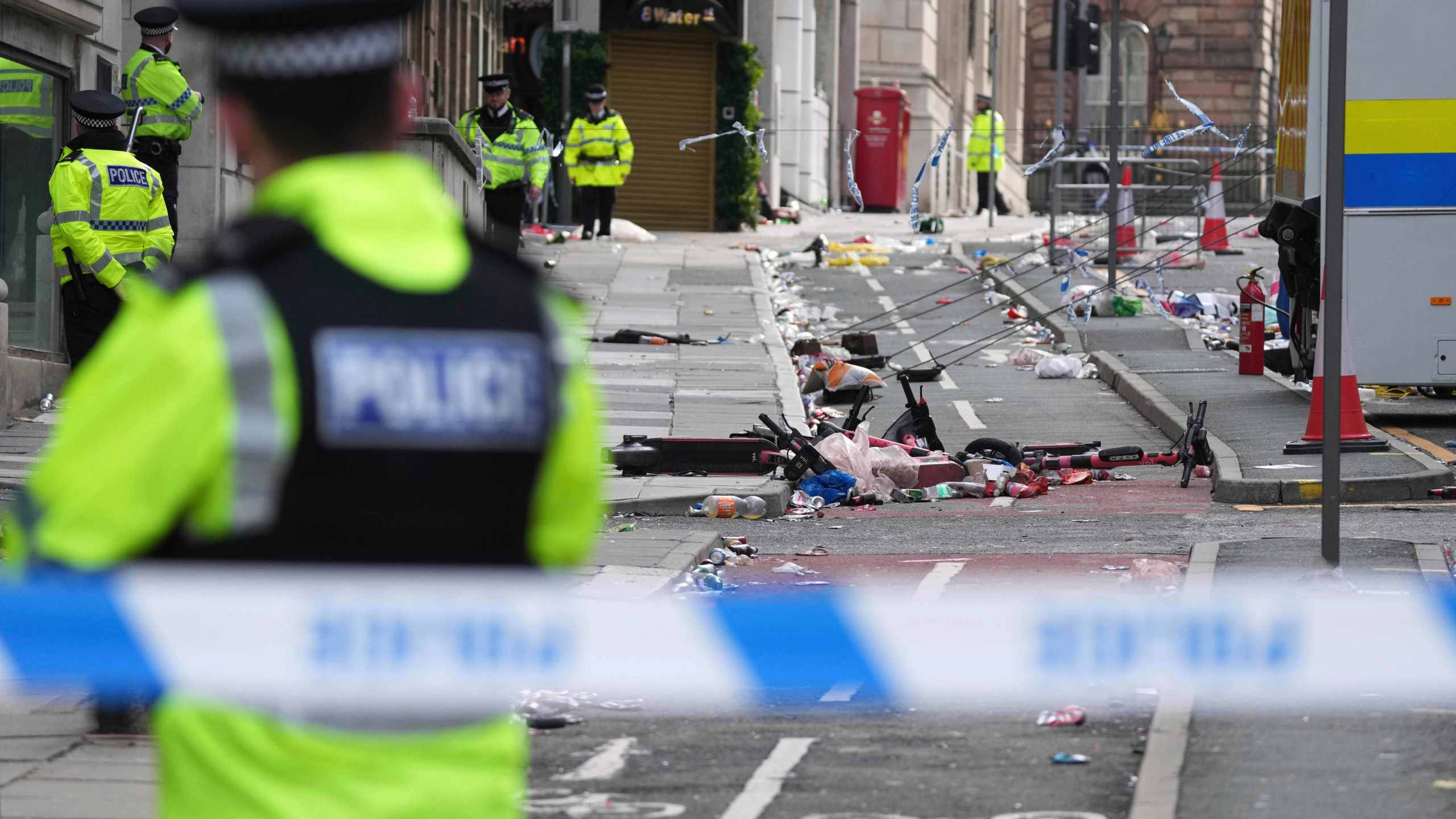 FILE - Police guards the site where a 53-year-old British man plowed a minivan into a crowd of Liverpool soccer fans who were celebrating the city's Premier League championship Monday, injuring more than 45 people in Liverpool, England, Tuesday, May 27, 2025.(AP Photo/Jon Super, File)