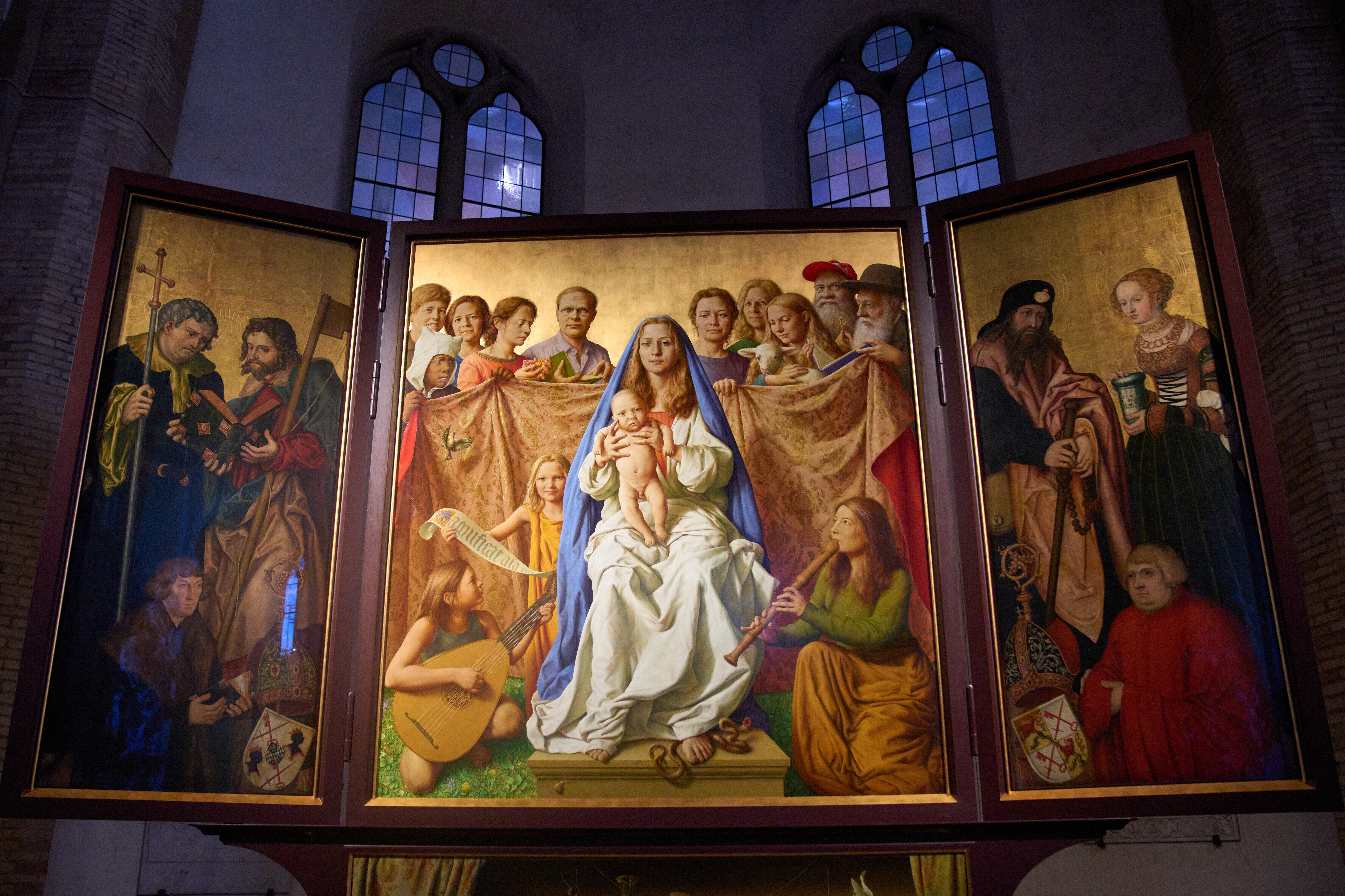 Burkhard Scheffler, second from right, a homeless man who died from the cold in 2022 on the edge of St. Peter's Square, is portrayed as St. Peter in a painting, the central of the triptych, by German artist Michael Triegel and exposed in the chapel of the Teutonic College at the Vatican, Wednesday, Dec. 10, 2025. (AP Photo/Alessandra Tarantino)