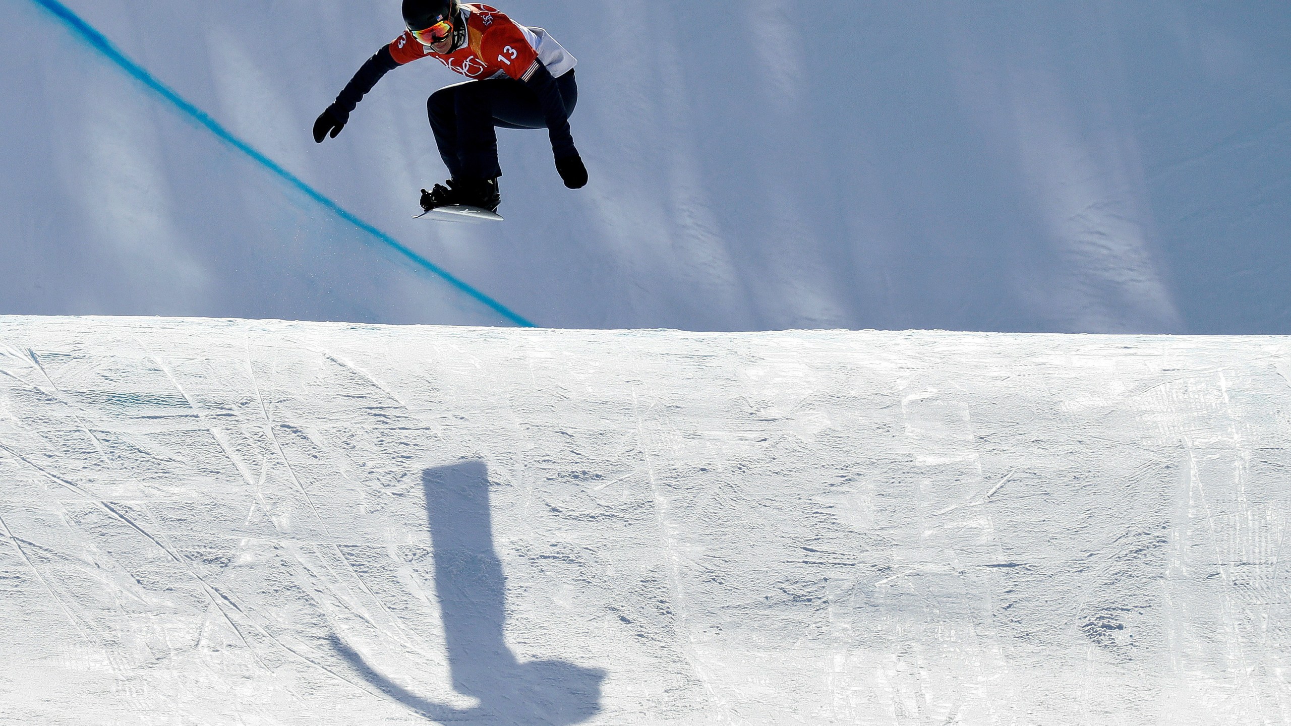 FILE - Lindsey Jacobellis, of the United States, jumps during the women's snowboard cross qualifying run at Phoenix Snow Park at the 2018 Winter Olympics in Pyeongchang, South Korea, Feb. 16, 2018. (AP Photo/Kin Cheung, File)