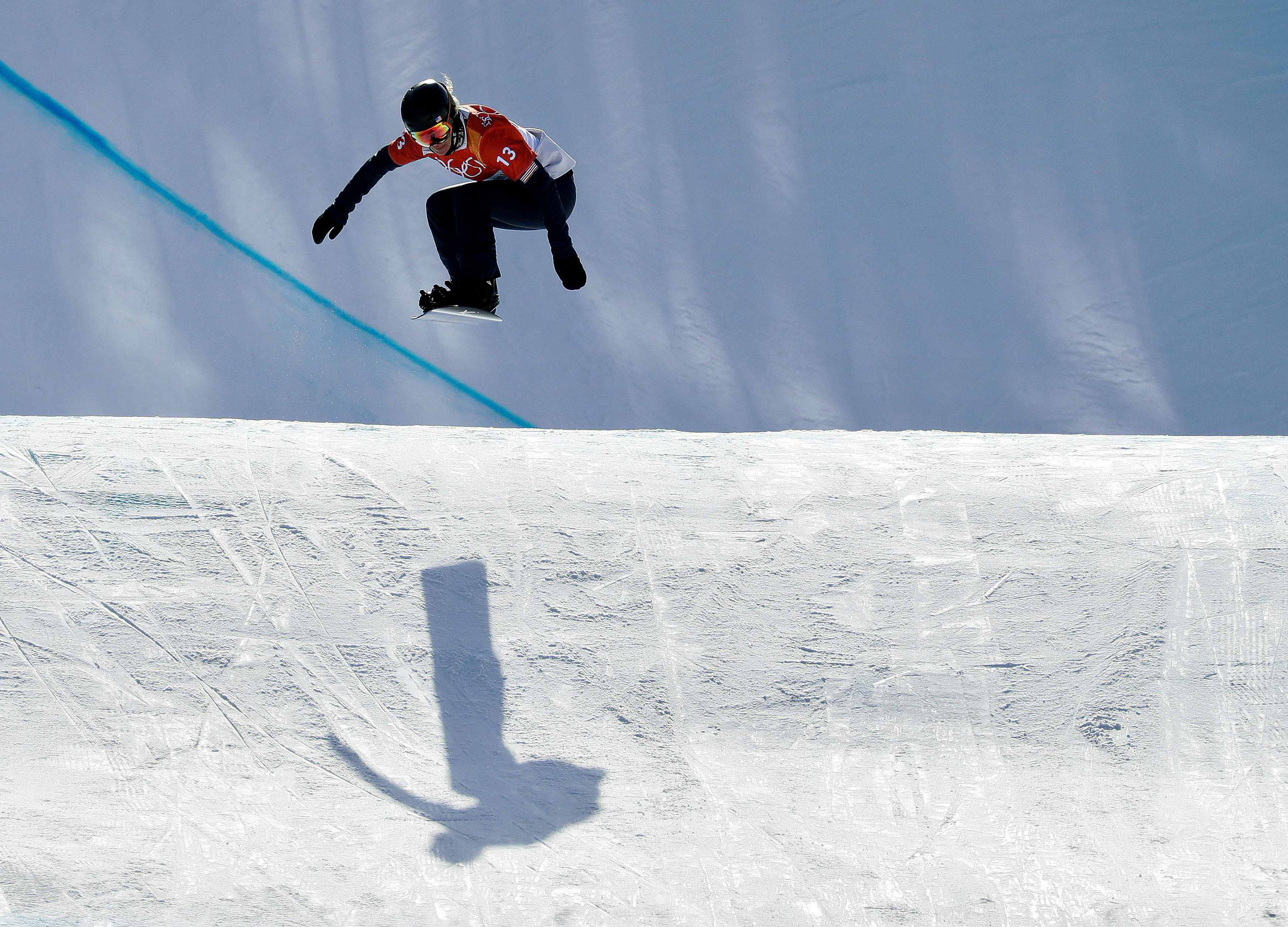 FILE - Lindsey Jacobellis, of the United States, jumps during the women's snowboard cross qualifying run at Phoenix Snow Park at the 2018 Winter Olympics in Pyeongchang, South Korea, Feb. 16, 2018. (AP Photo/Kin Cheung, File)